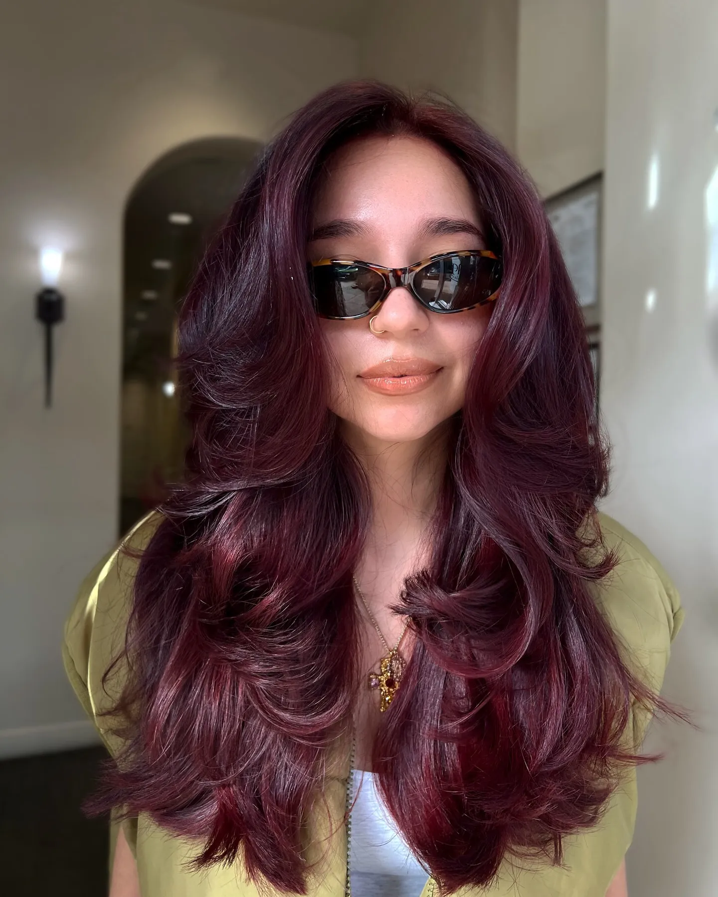Long Feathered Layers showing maroon hair colour
