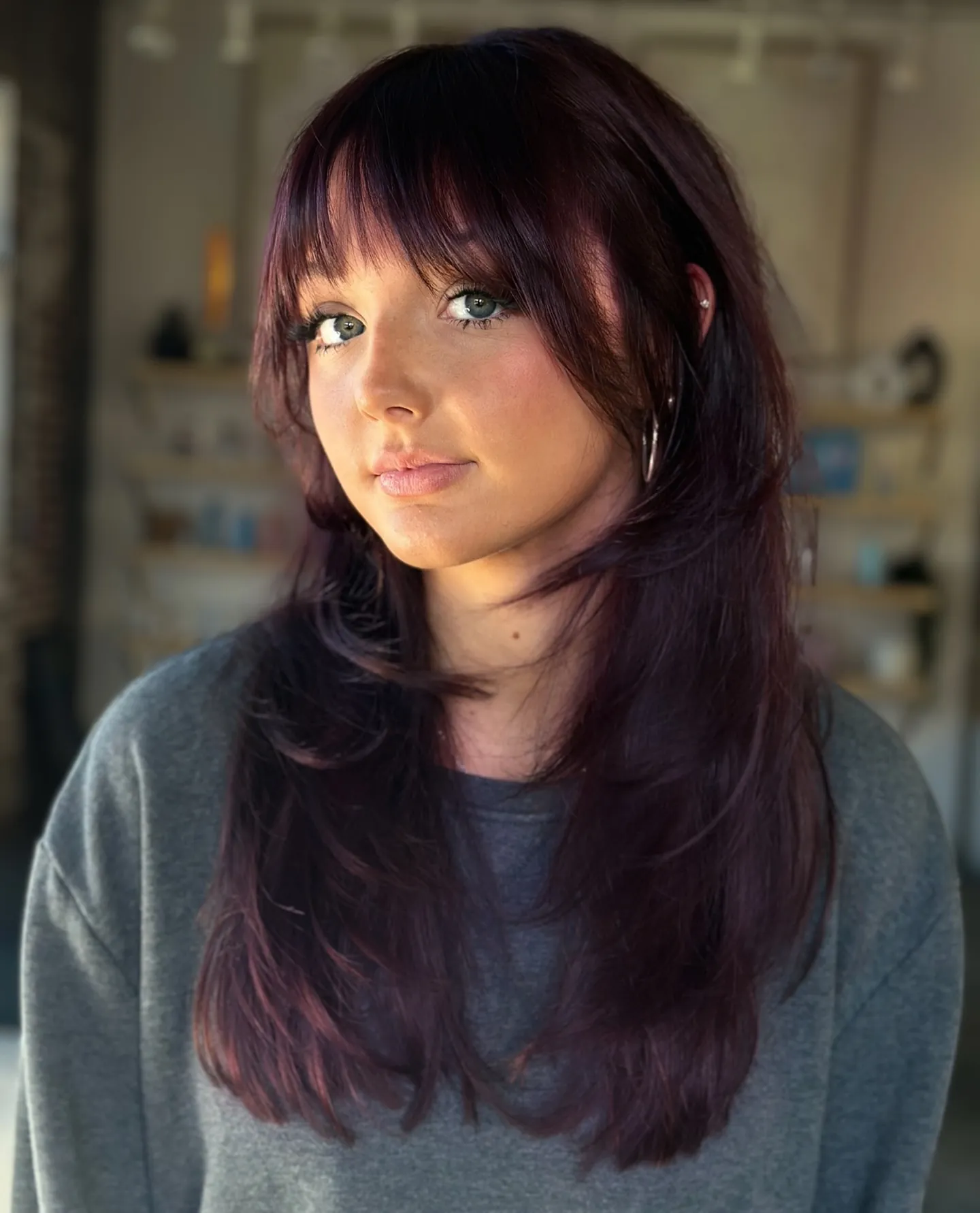 Wispy Maroon Layers showing maroon hair colour