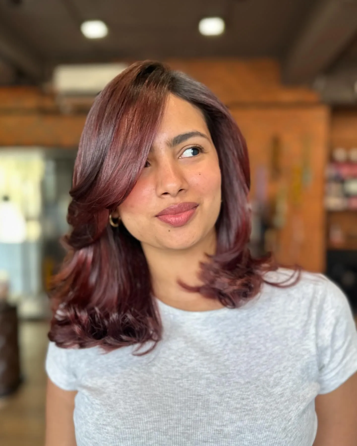 Shoulder-Length Maroon Waves showing maroon hair colour