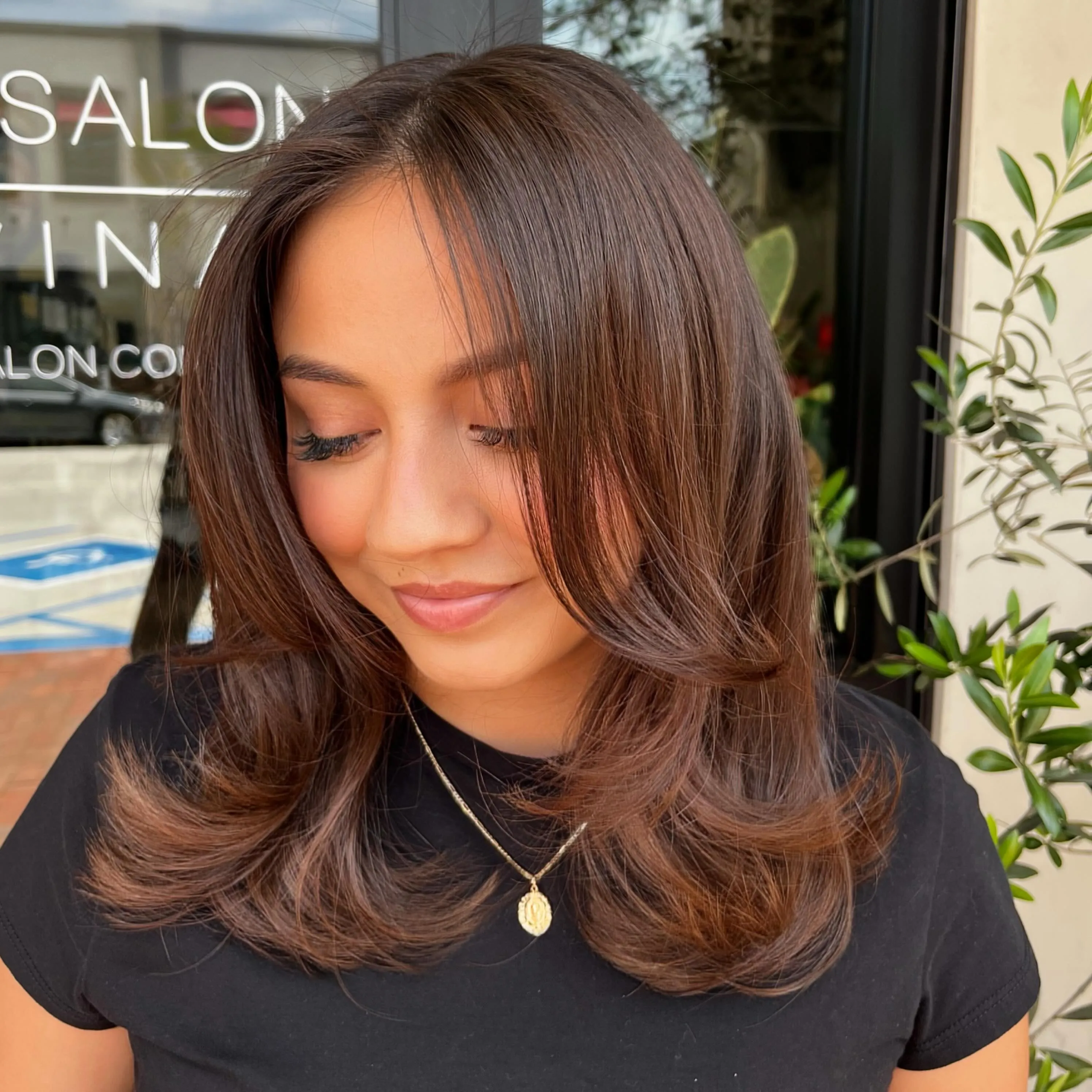 Chestnut medium-length hair with soft curtain layers
