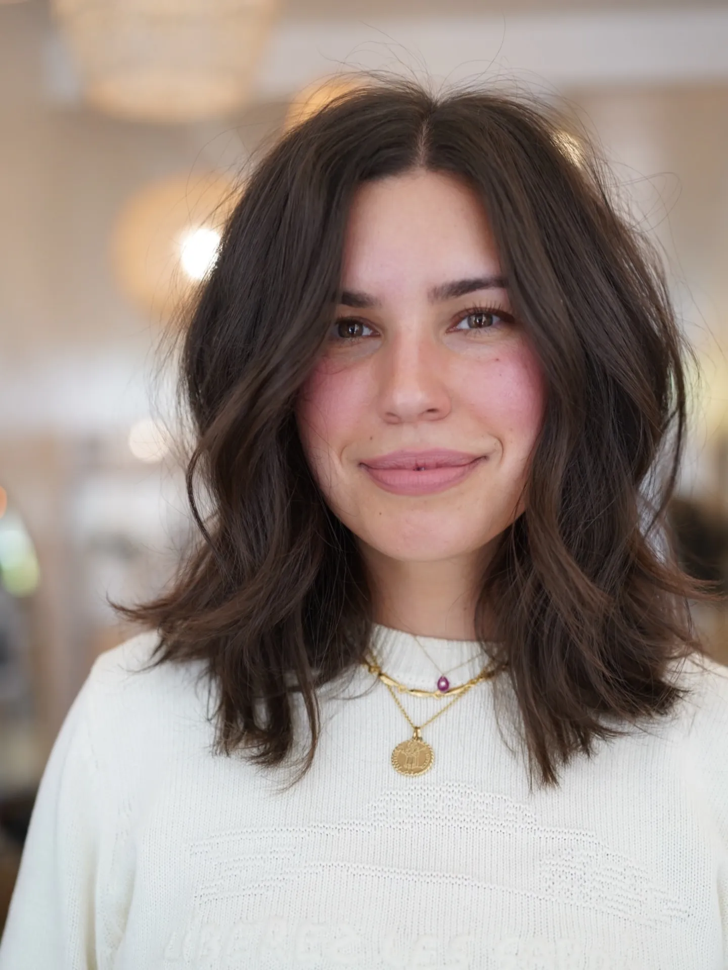 Soft wavy medium-length hair with subtle layers