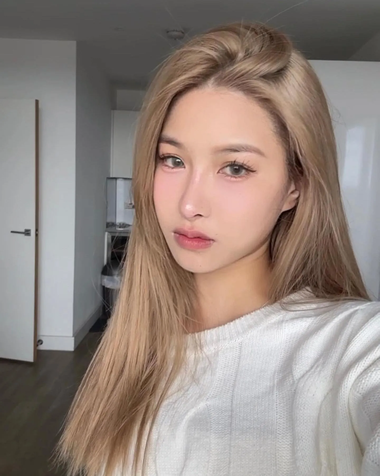 Long smooth blonde layers with a lifted side part