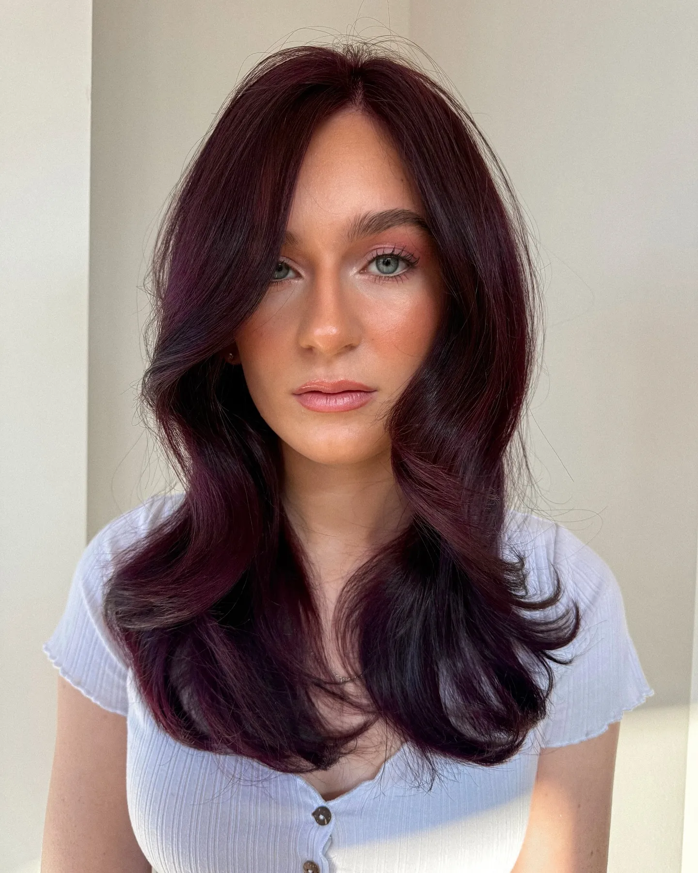 plum hair with smooth face framing