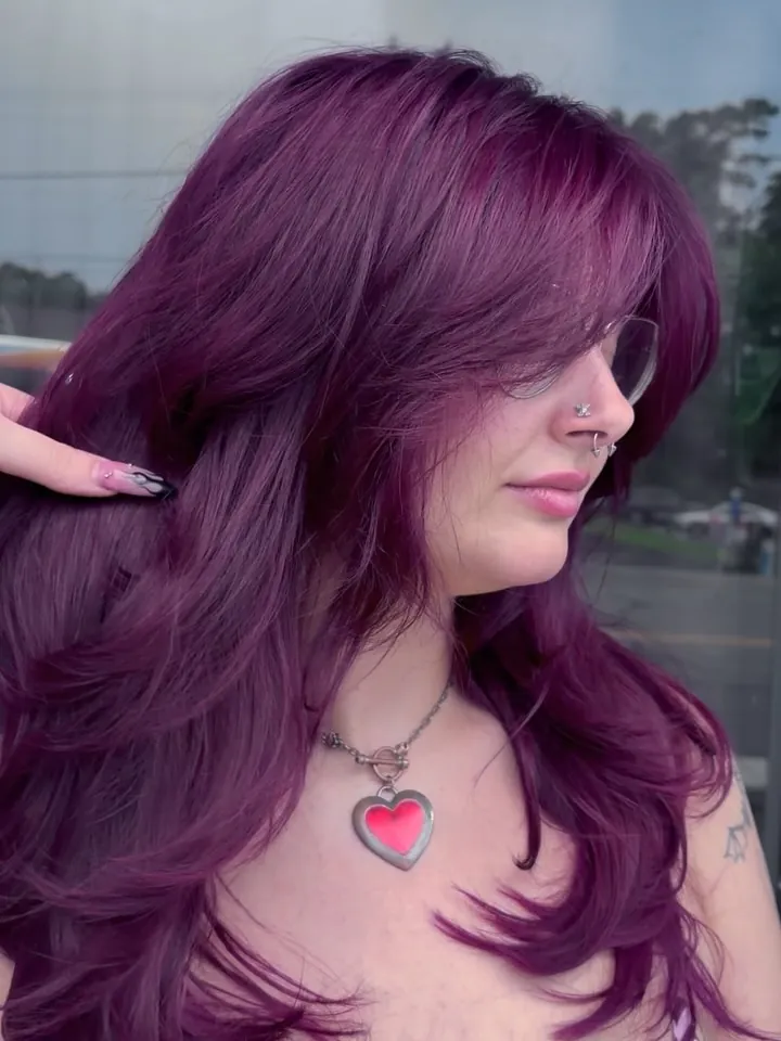 plum hair with side-swept layers