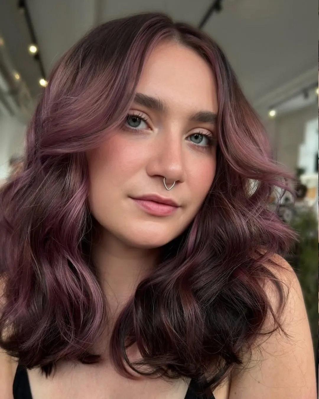 plum hair with soft wavy lob