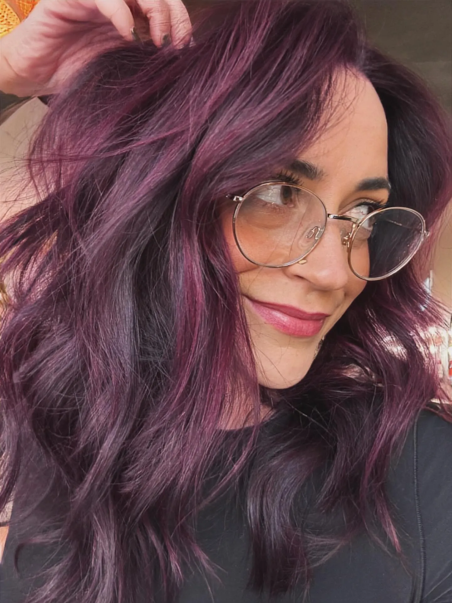 plum hair with tousled wavy lob
