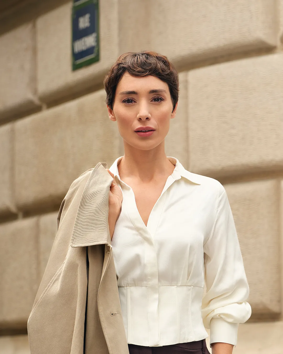 Short sculpted pixie with a glossy side wave across the front