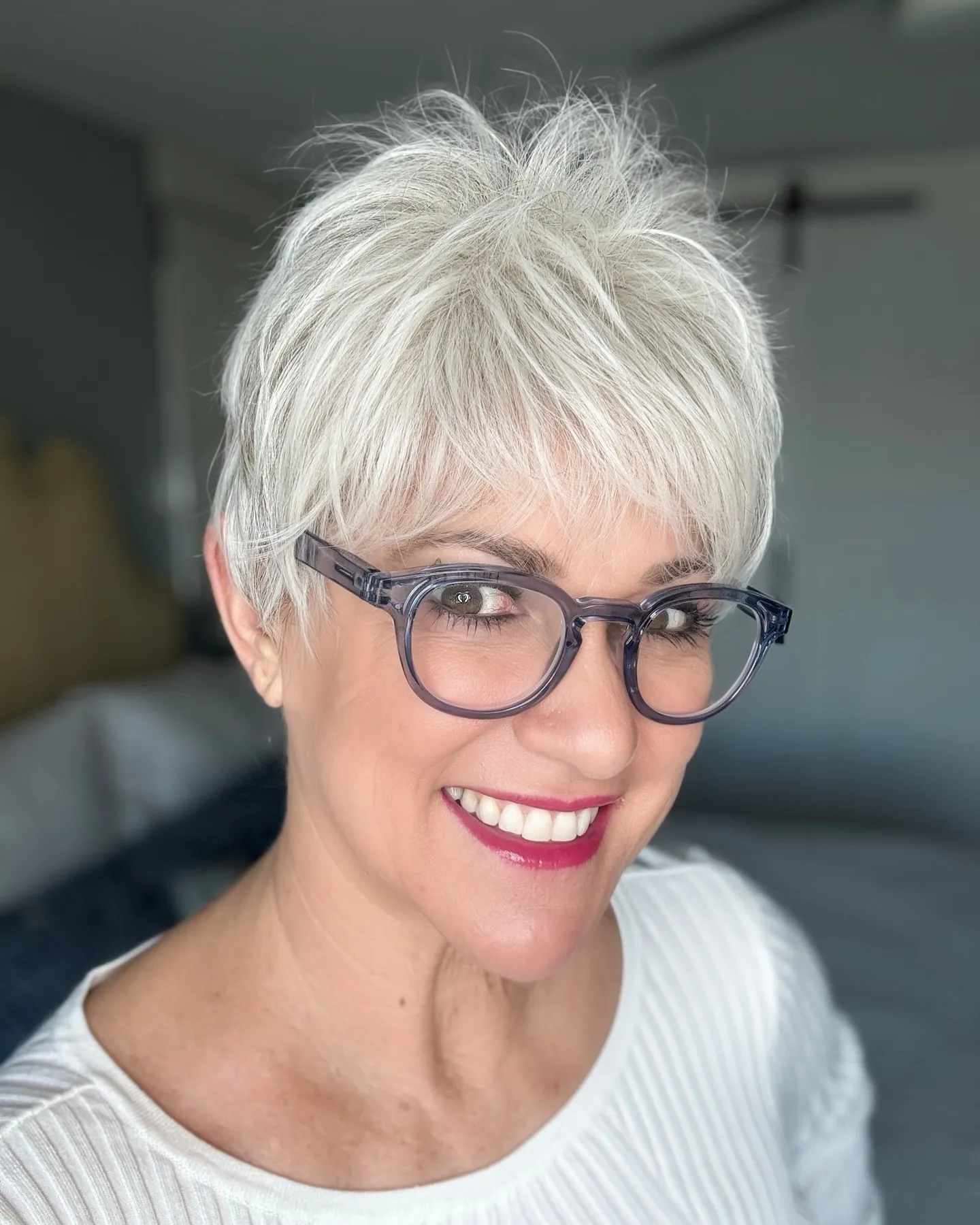 Wispy silver pixie with feathered layers and a light fringe