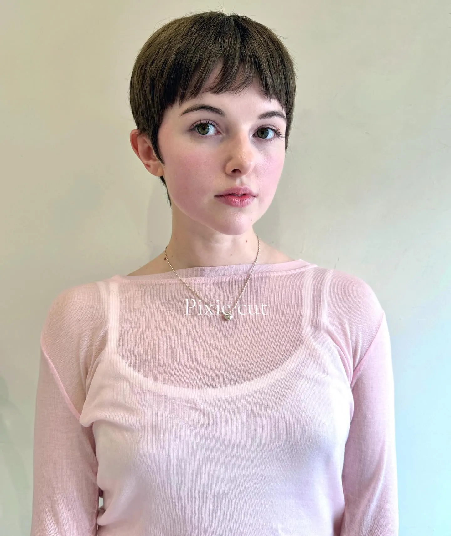 Smooth short pixie with a rounded fringe and neat tapered sides