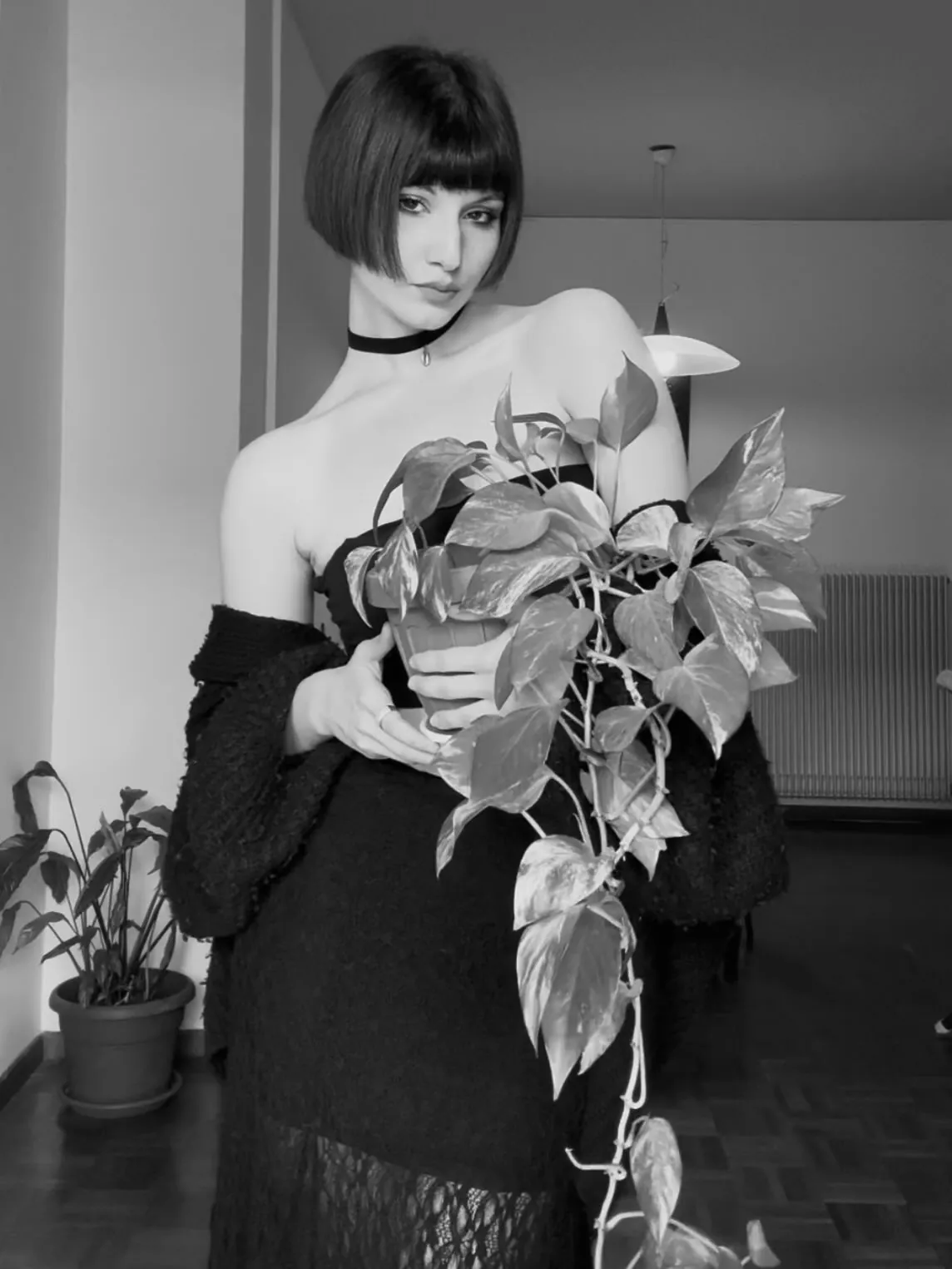Short black Prada bob with graphic straight fringe