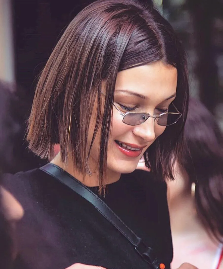 Straight brunette Prada bob with centre part