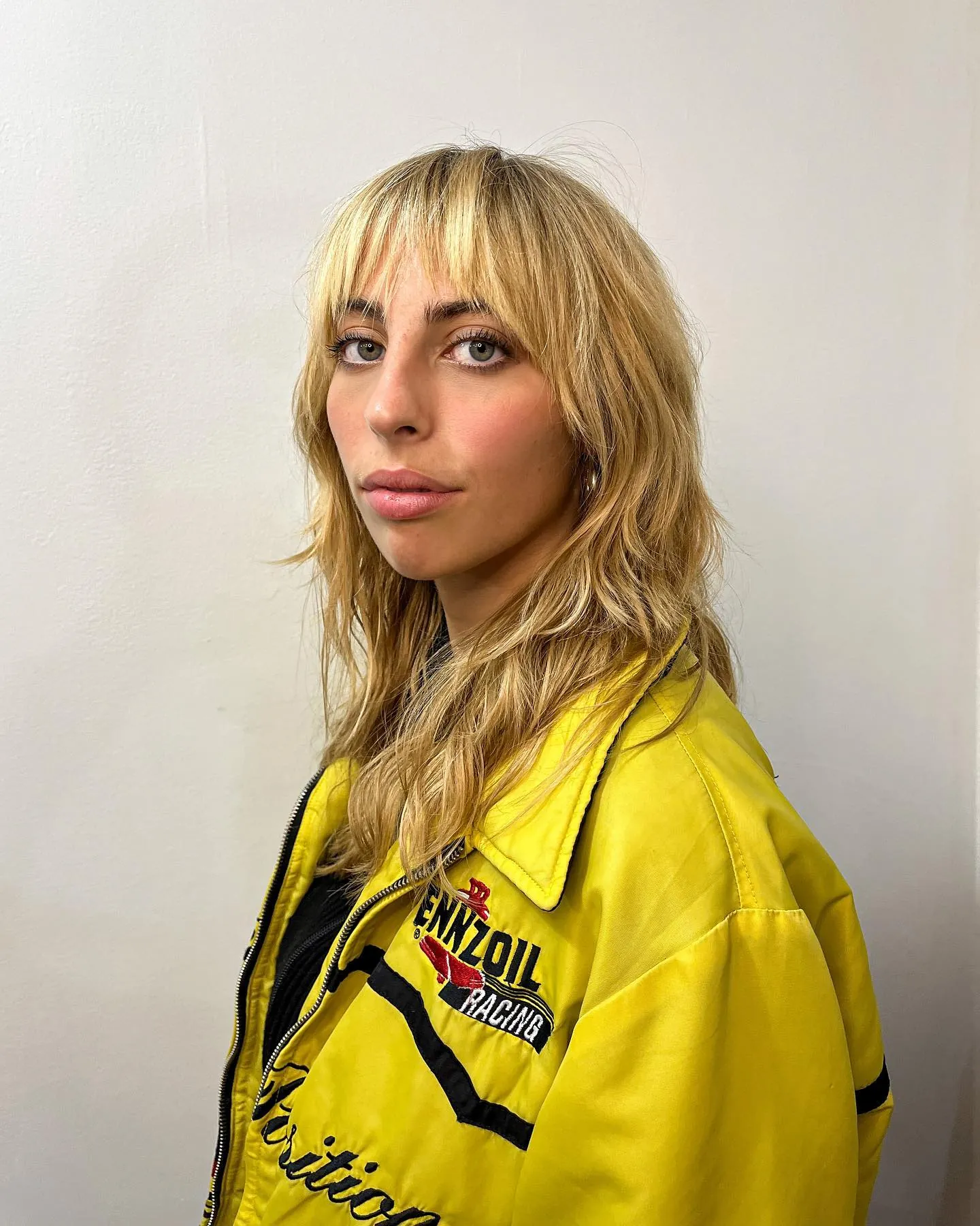 Blonde Shag With Bangs with 1970s-inspired layering
