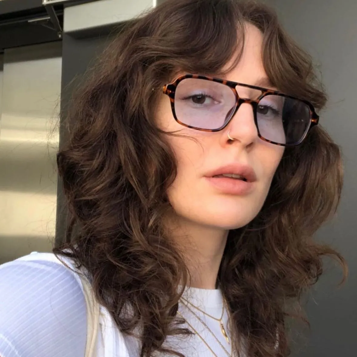 Dark wavy shag with curtain bangs and layered ends