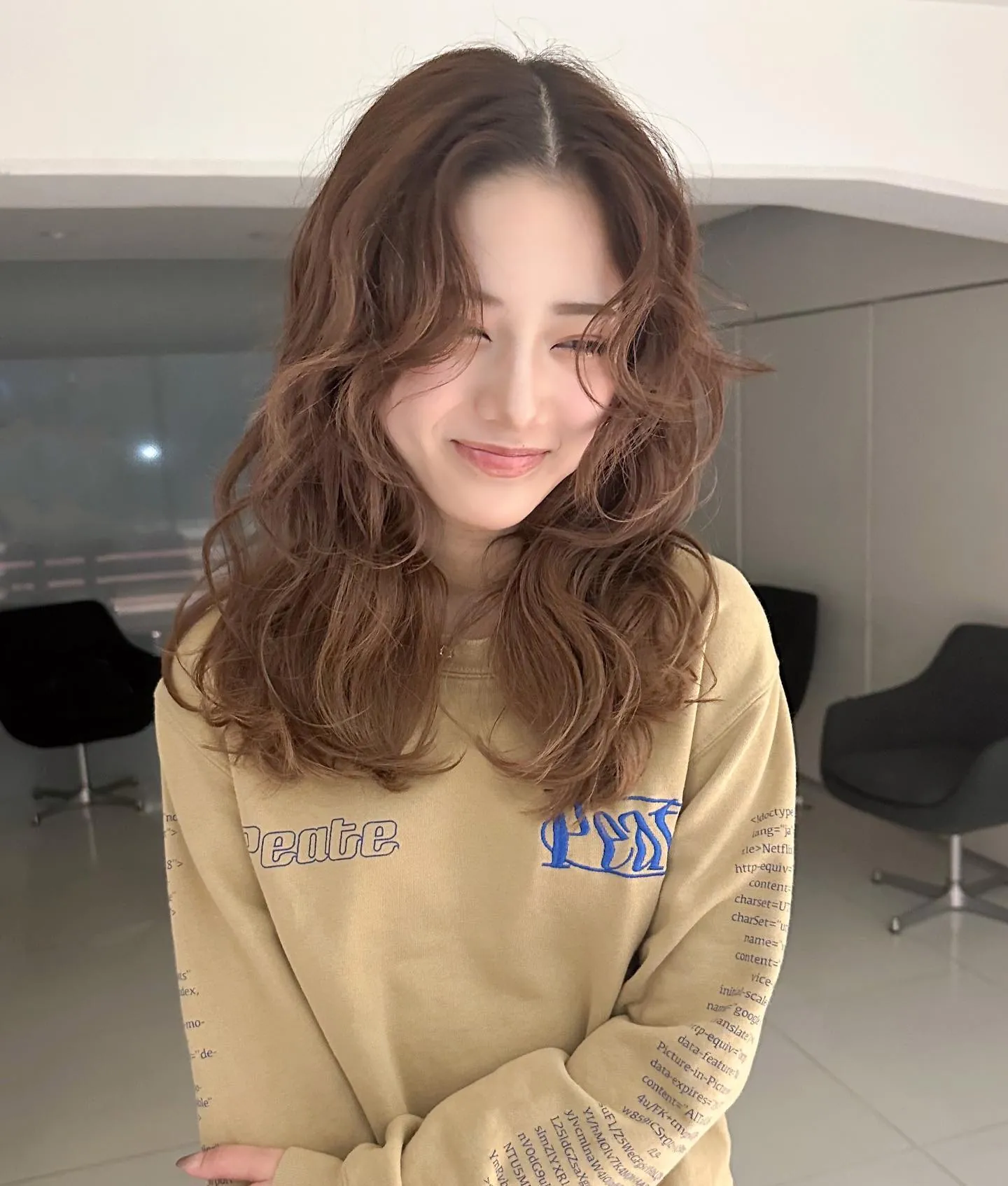 Medium brunette waves with soft face-framing layers