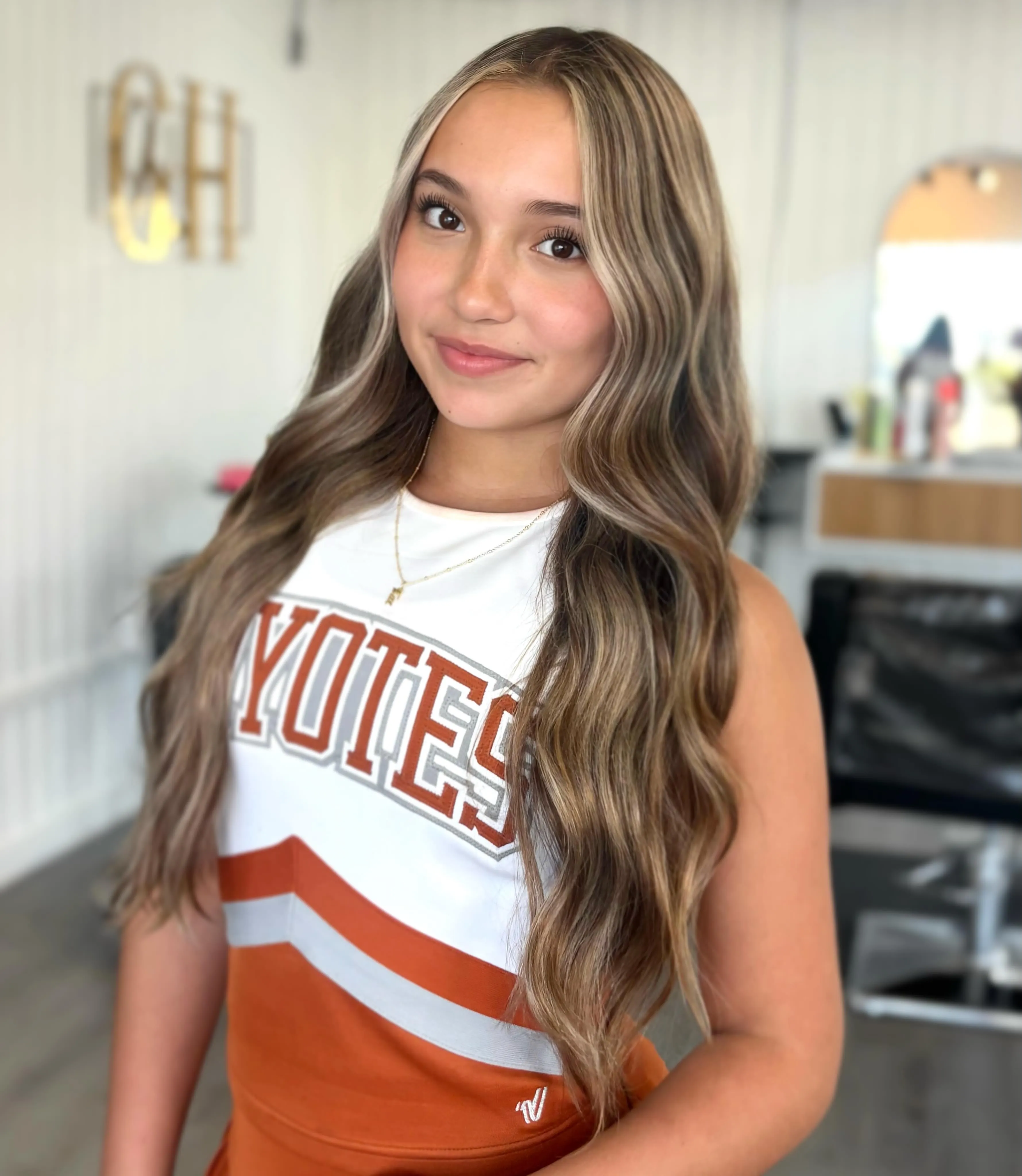Long brunette waves with light face-framing pieces