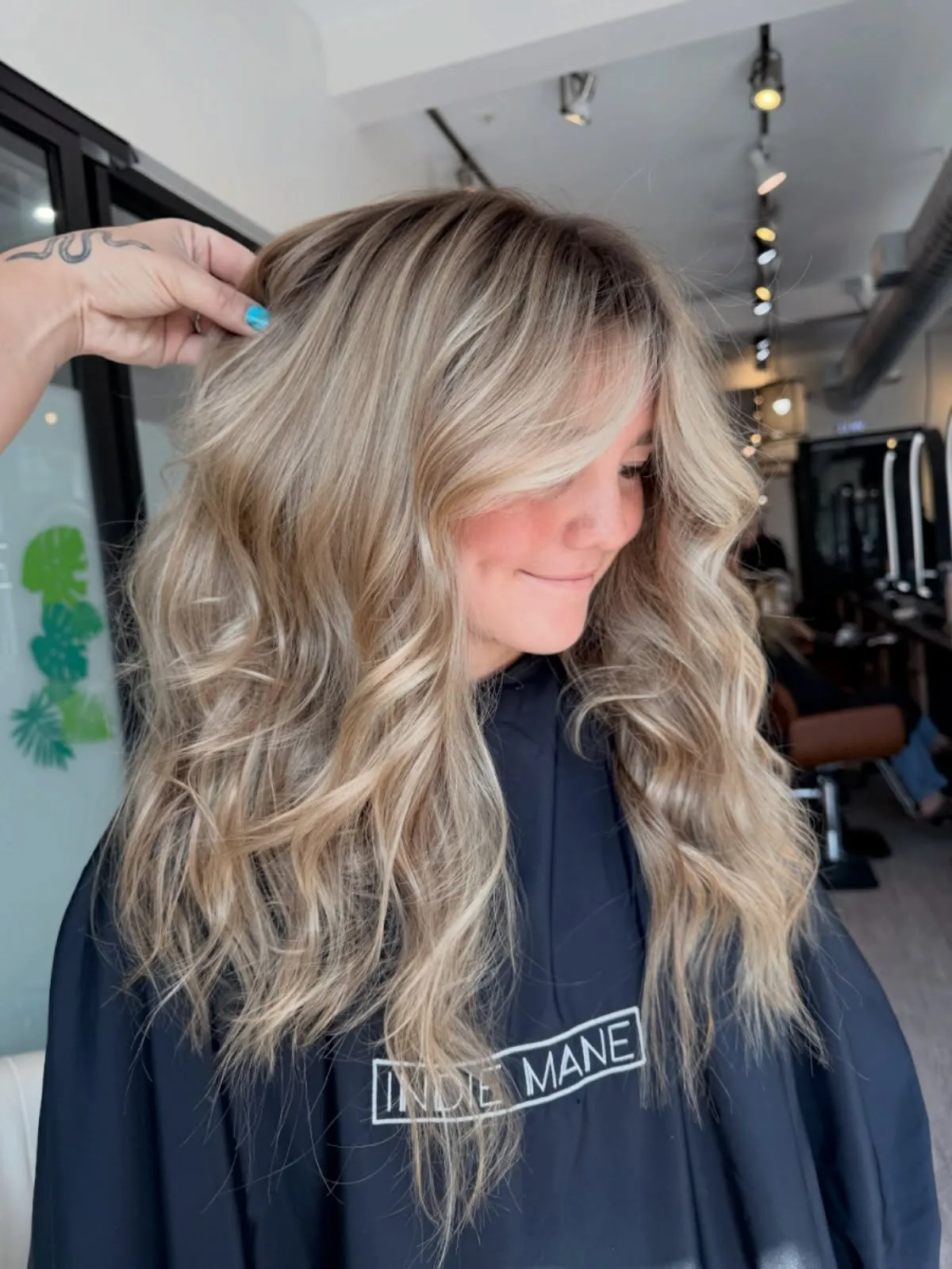 Long platinum blonde waves with layered volume