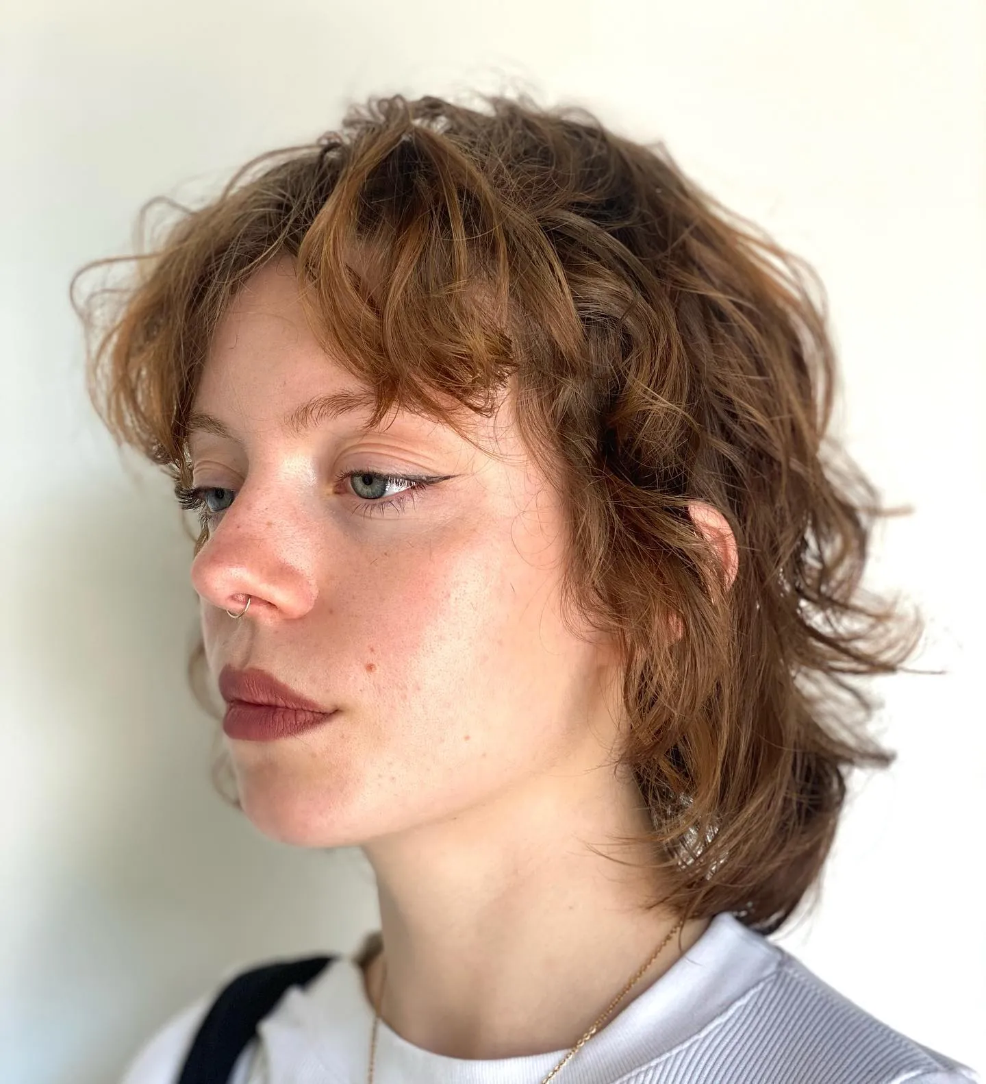 Short auburn wavy shag with tousled fringe