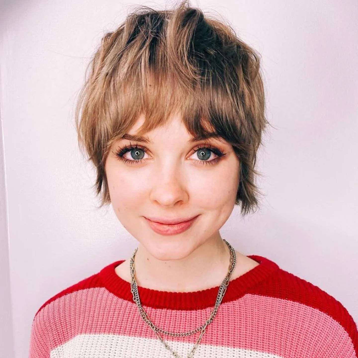 Shaggy pixie with curtain fringe and longer layered back