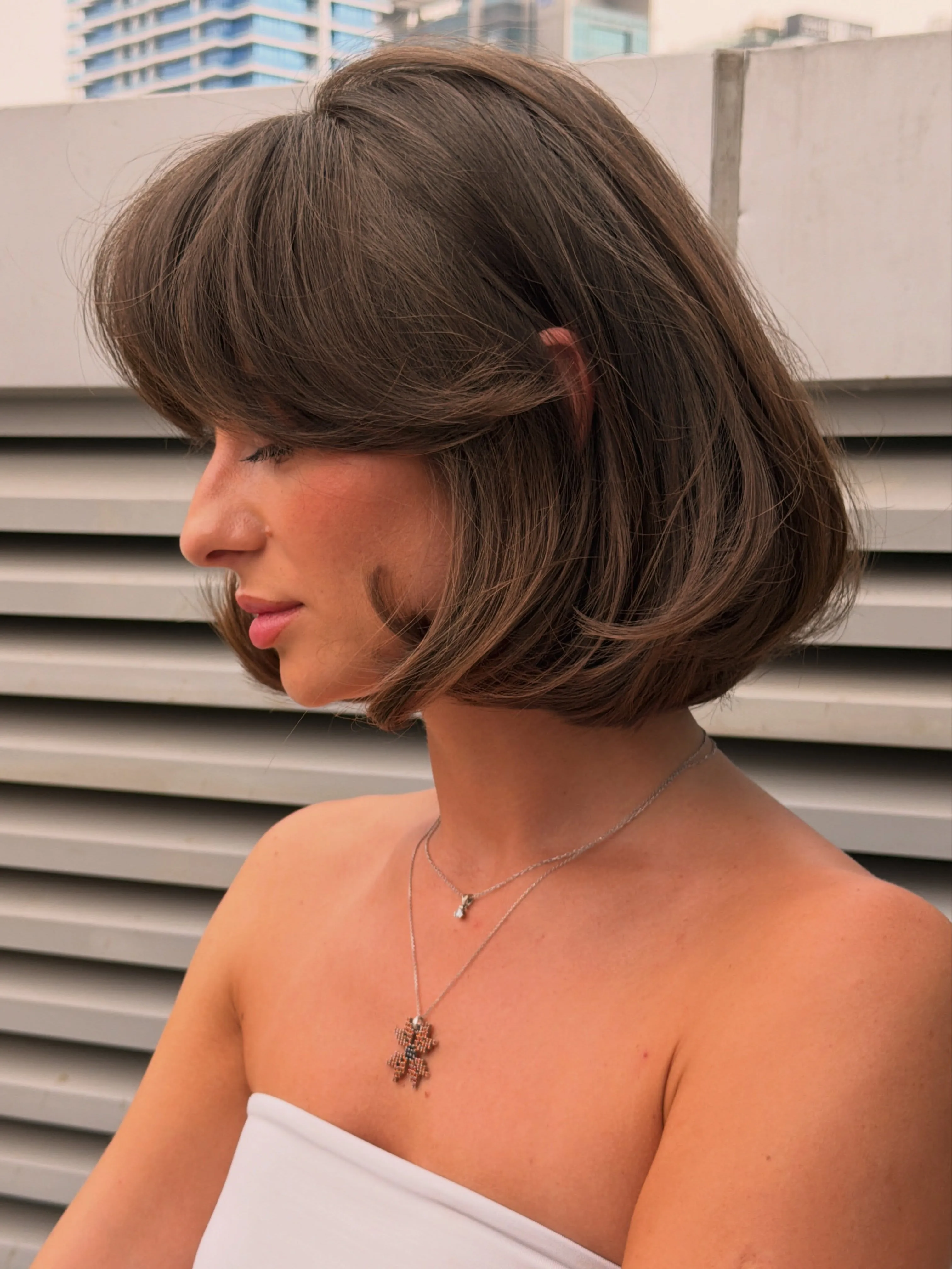 Rounded brunette bob with sweeping curtain fringe