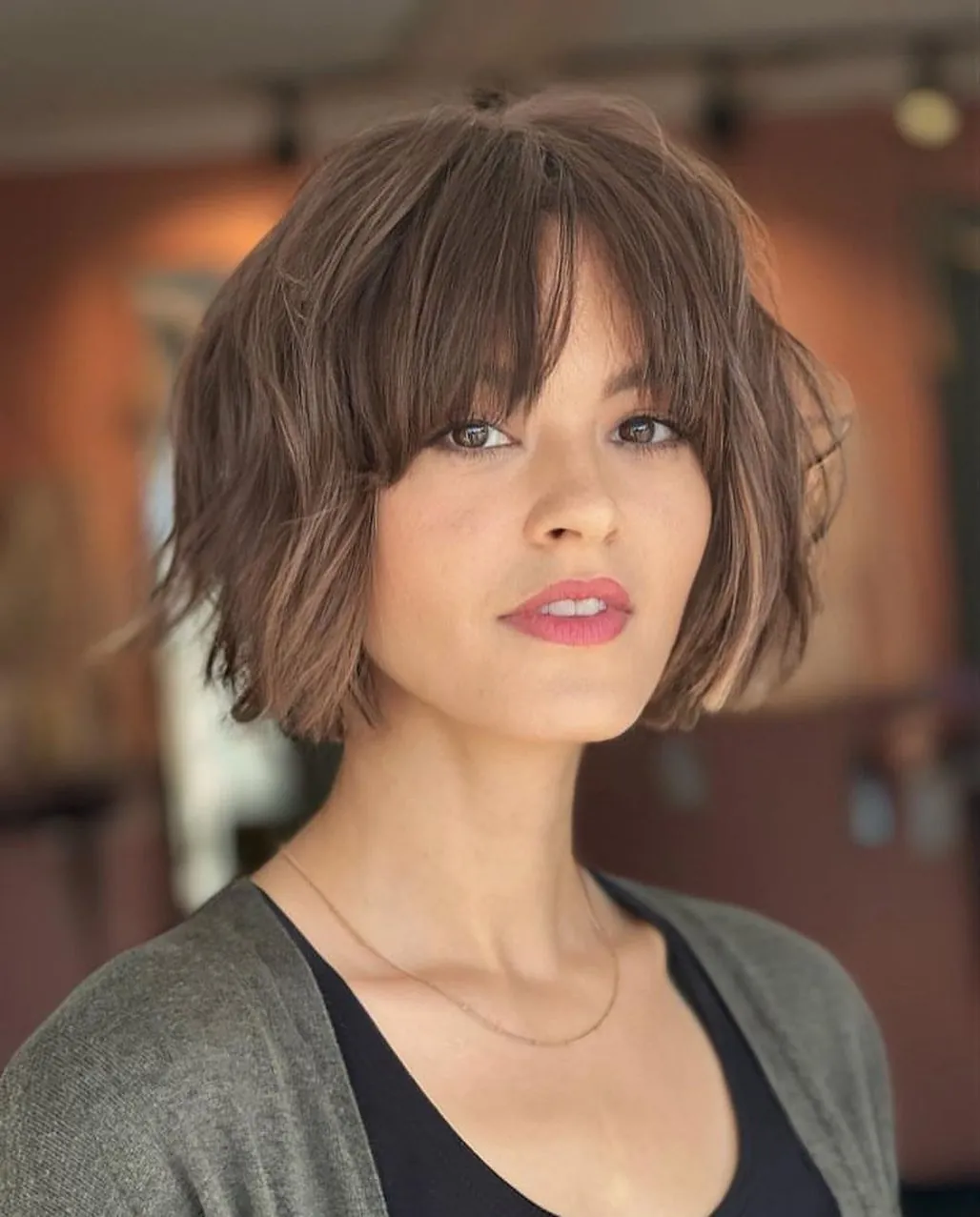 Tousled brunette bob with soft curtain bangs