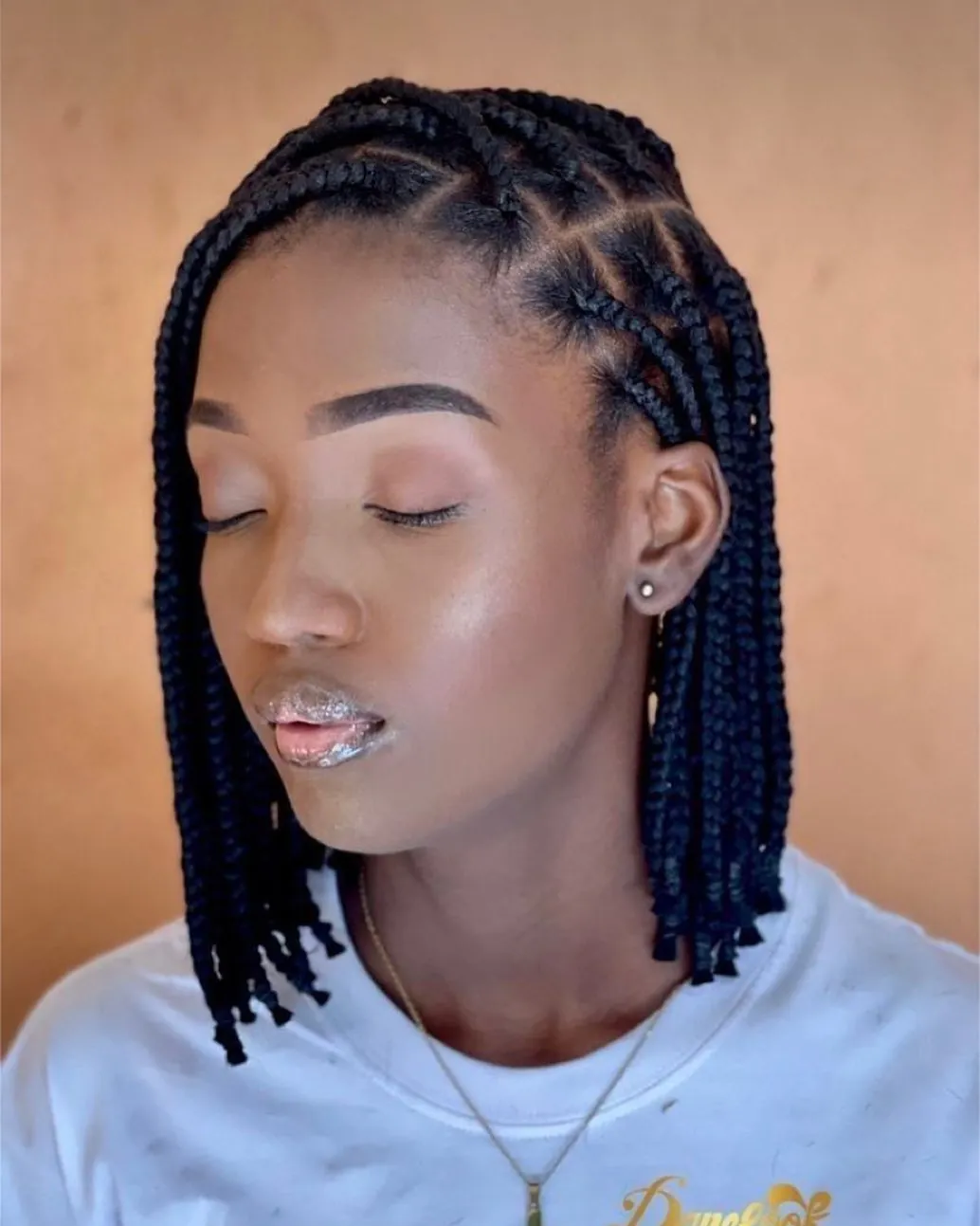 Braided bob with side cornrows and clean parting