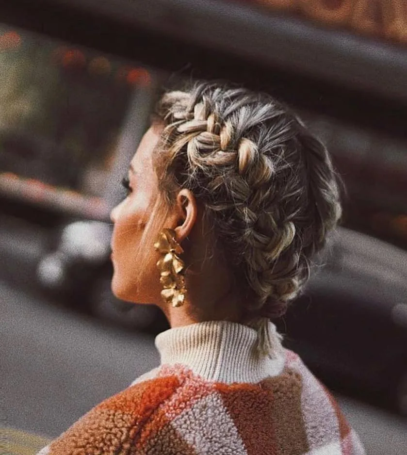 Short hair with raised braided rows running toward the back