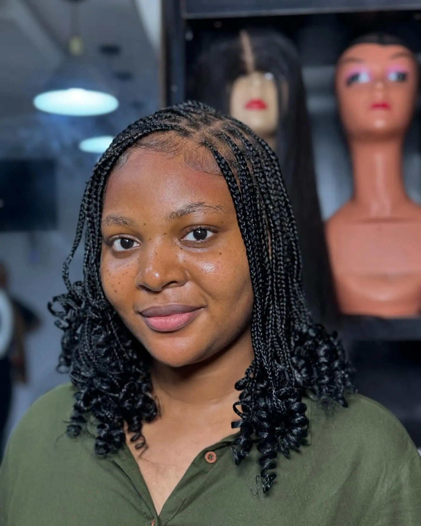Short braids with curly ends around jaw length