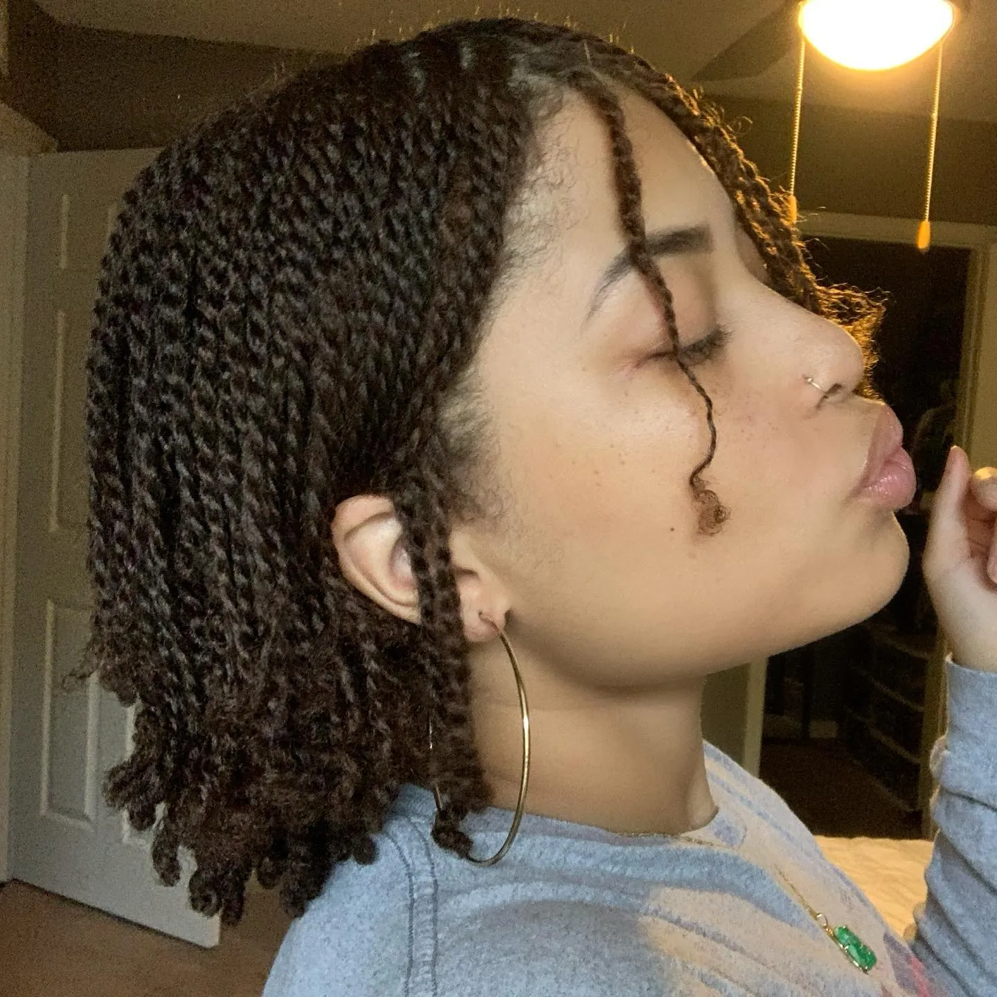 Short twist bob with two loose face-framing tendrils