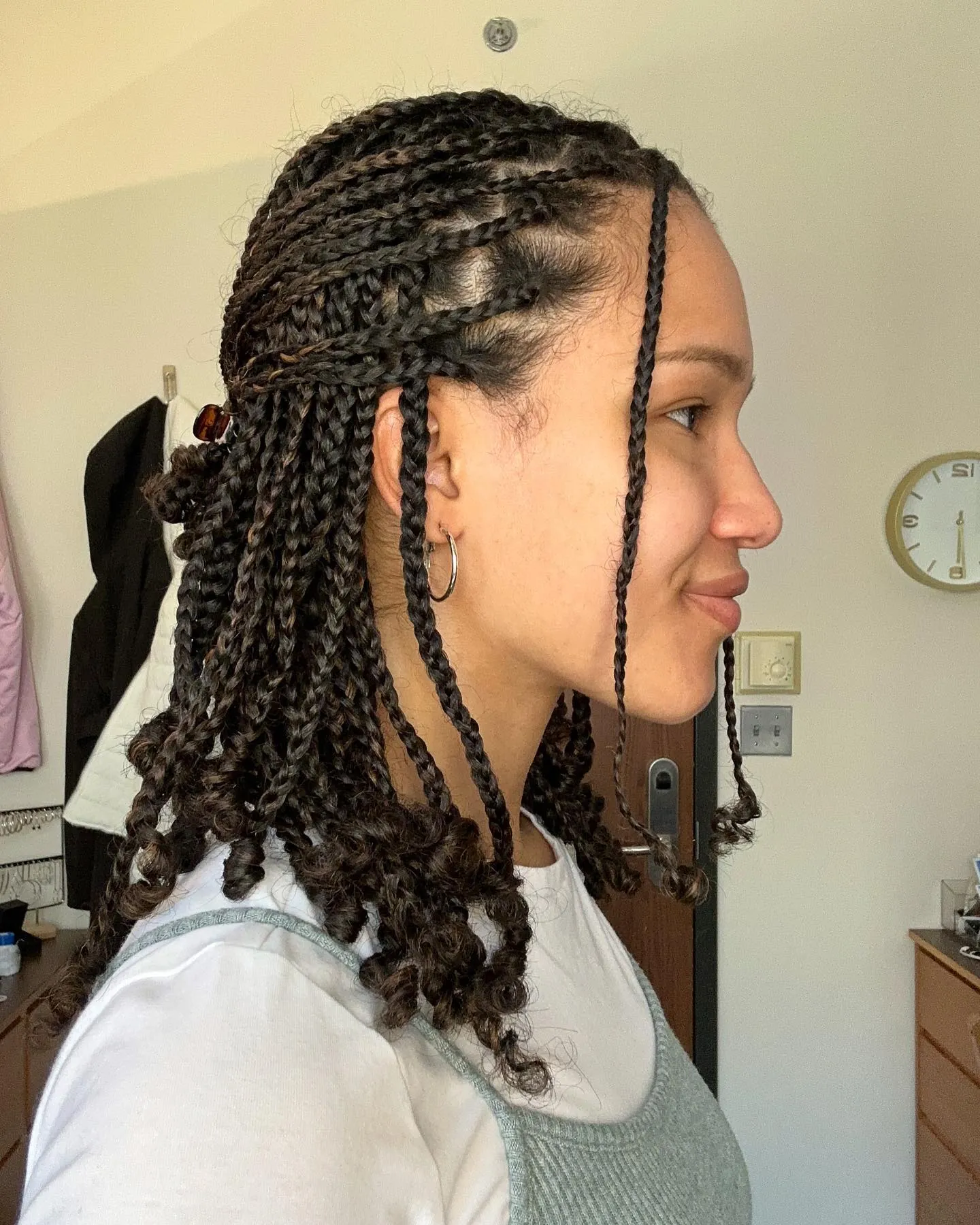 Short cornrows flowing into loose curly ends