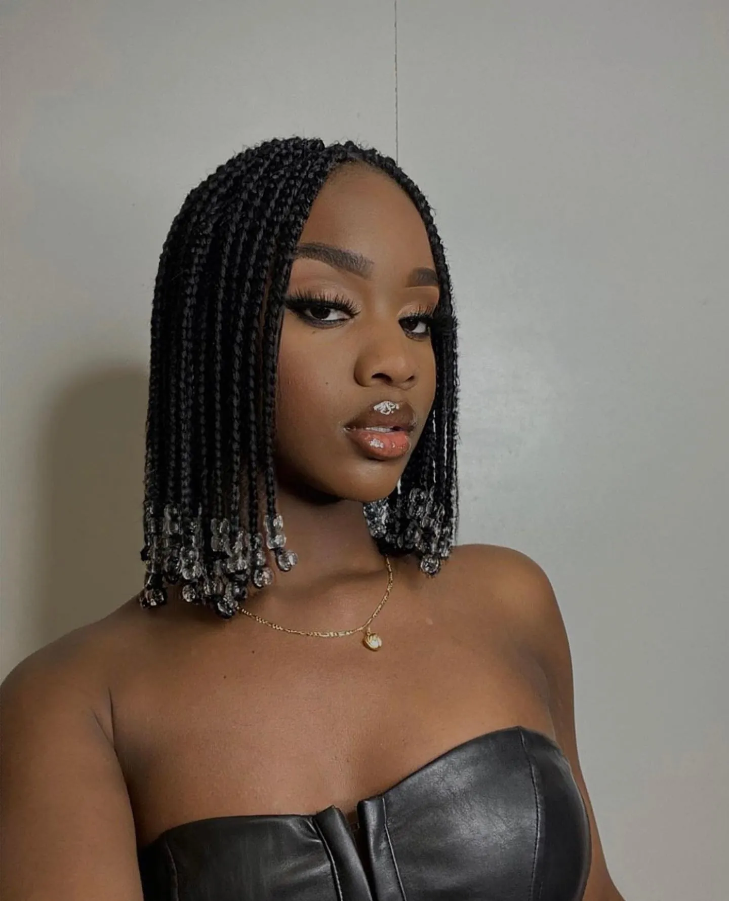 Short braided bob with clear beads at the ends