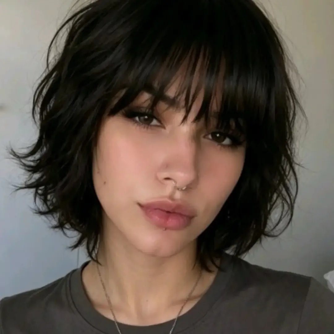 Messy black bob with long wispy bangs
