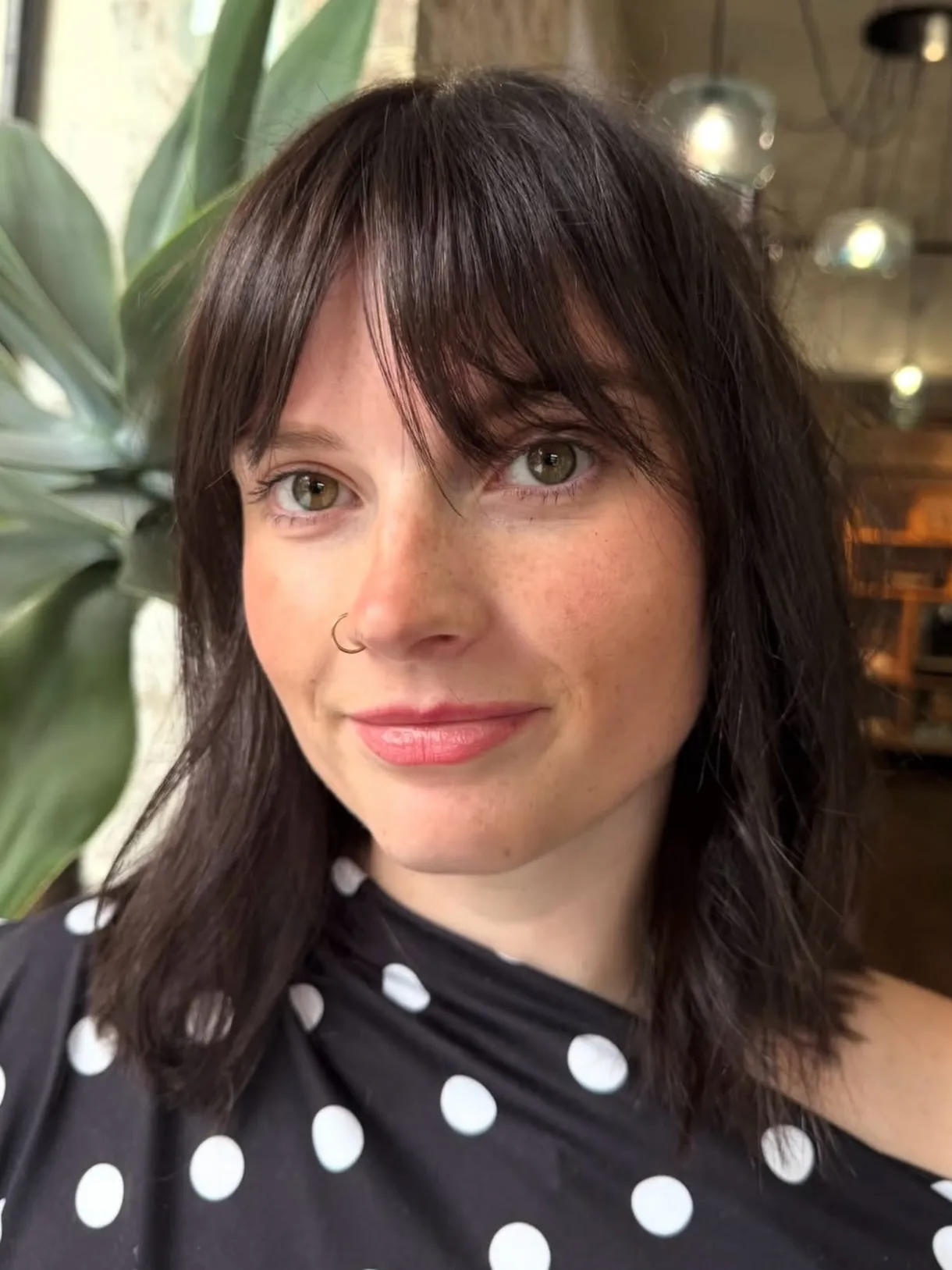 Long dark bob with soft wispy curtain bangs