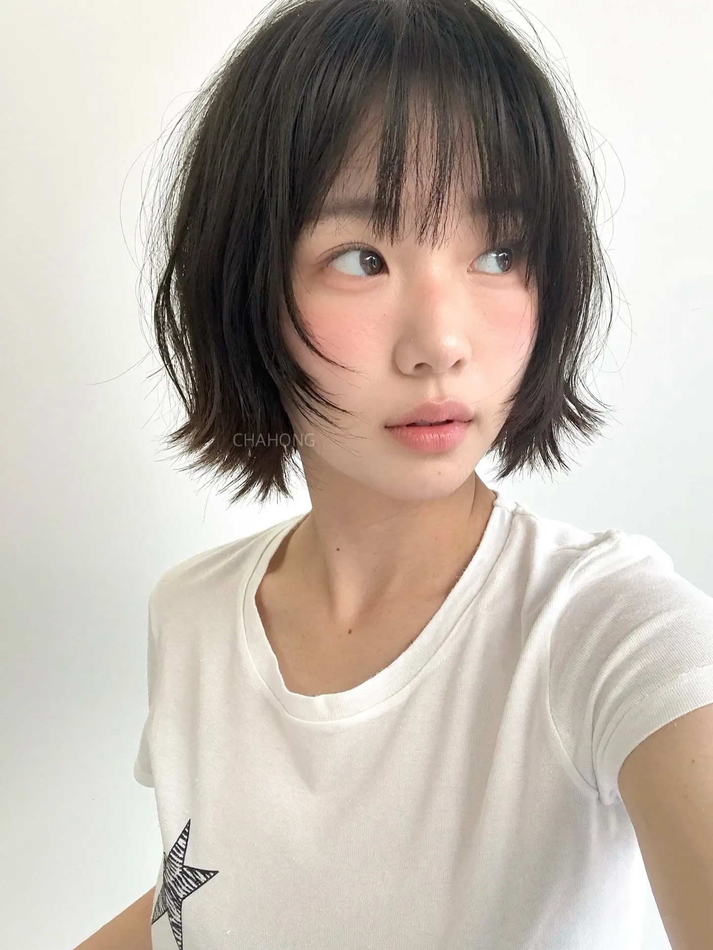 Short black bob with fine wispy bangs