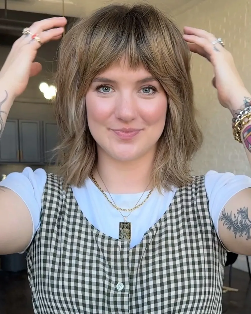 Layered shoulder-length shag with curtain bangs