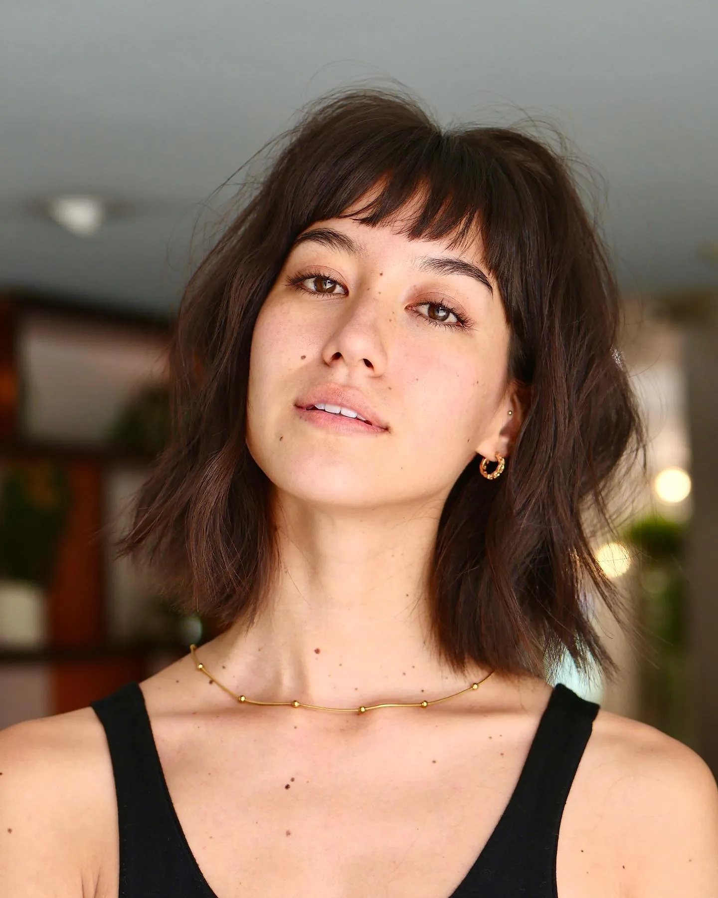 Soft brown shag with wispy bangs