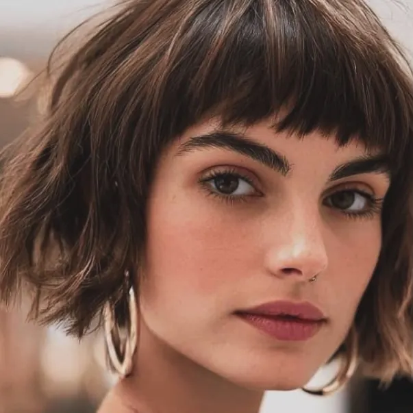 Textured short brown bob with choppy bangs