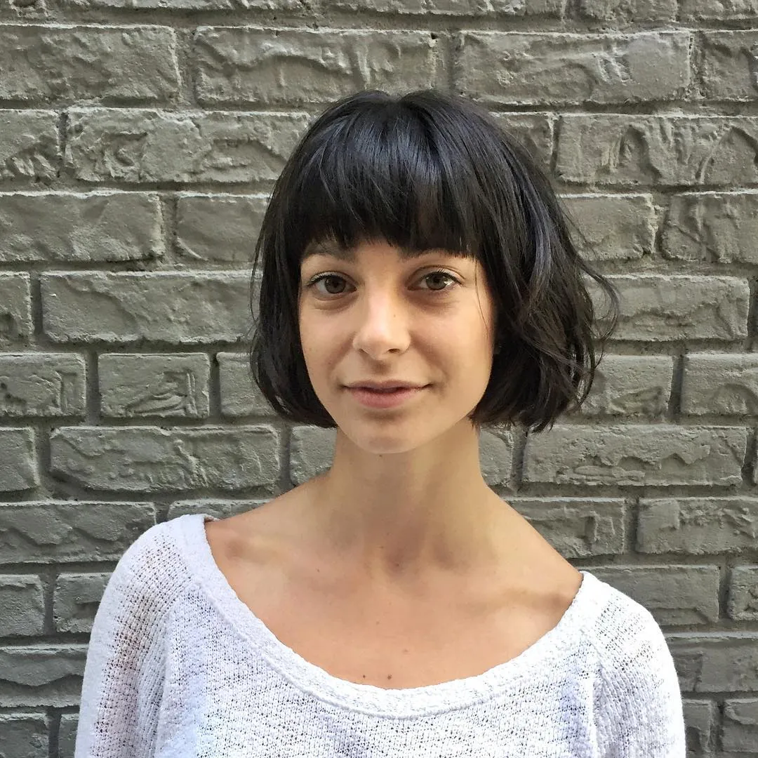 Rounded black bob with full straight bangs