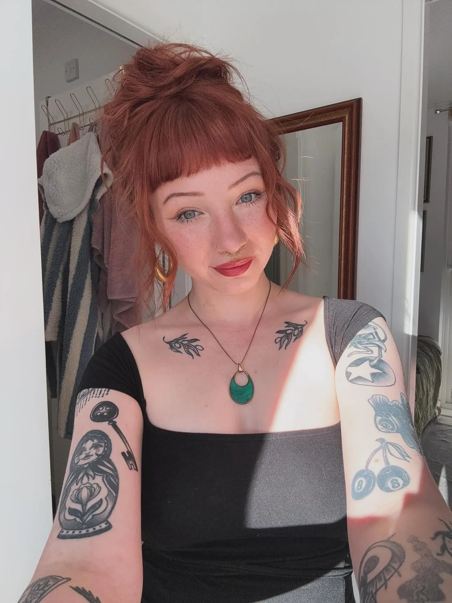Red curly updo with short curled bangs