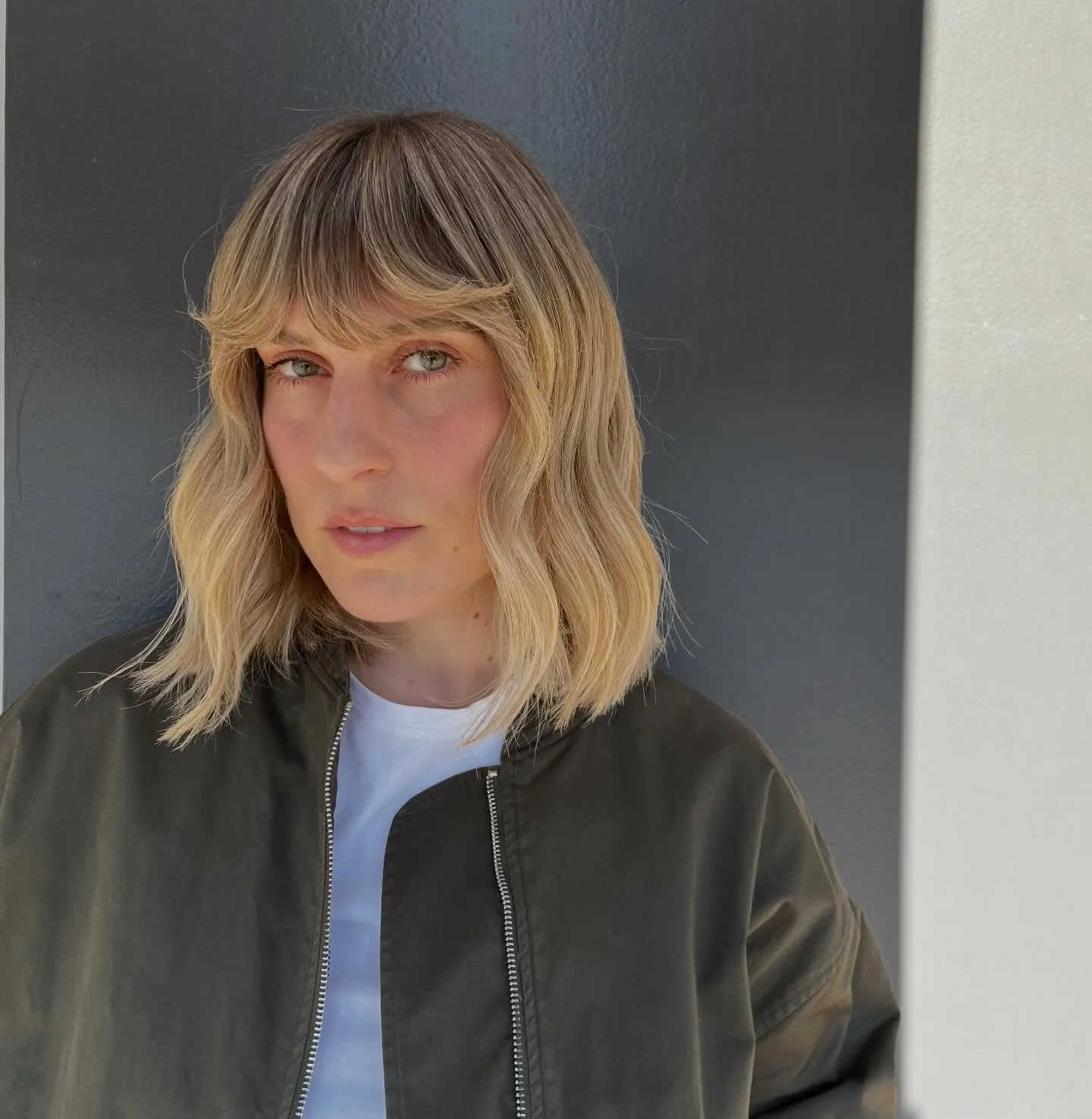 Blonde wavy lob with curtain bangs