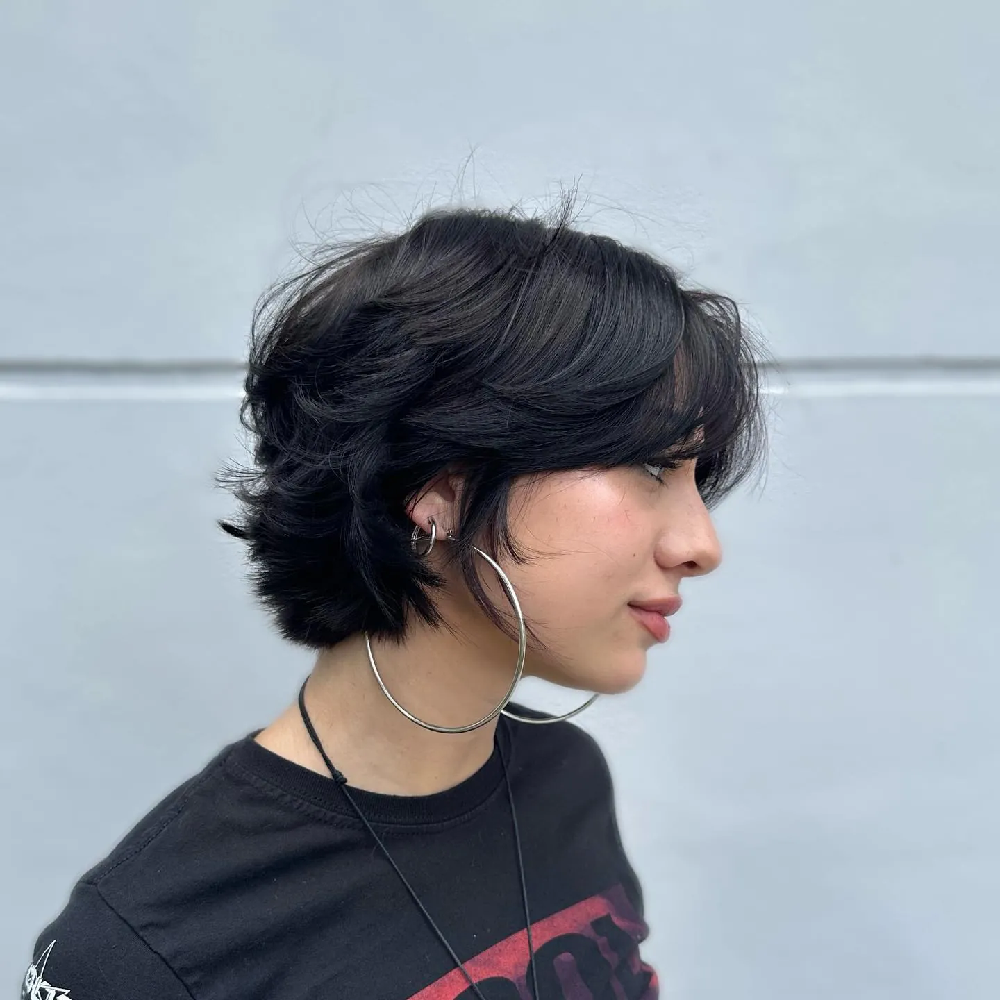 Dark side-swept bixie with flipped layered ends