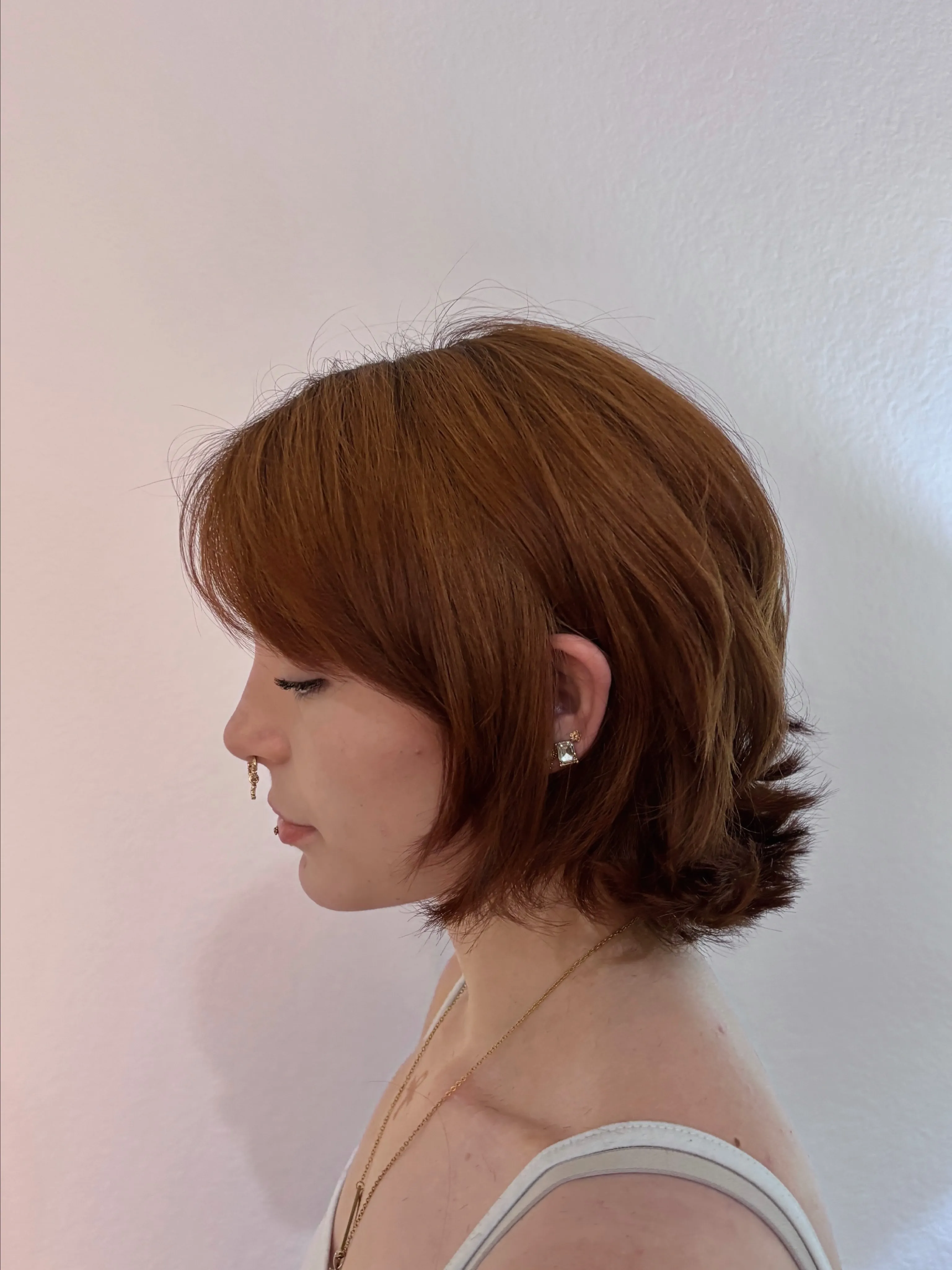Copper layered bob with longer pieces through the nape