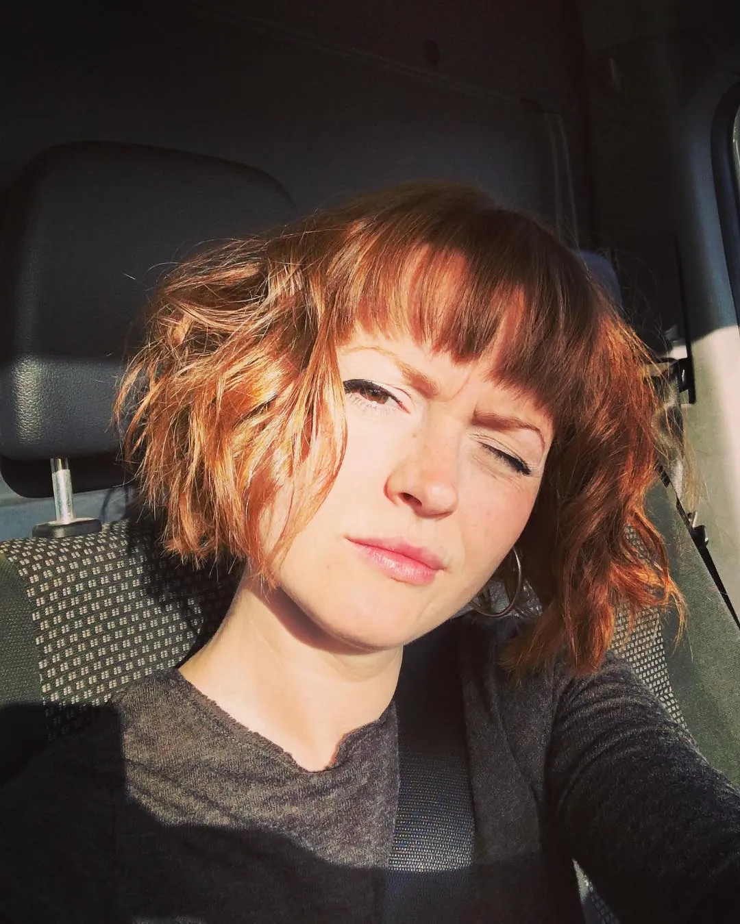 Tousled Fringe Bob in short red hair