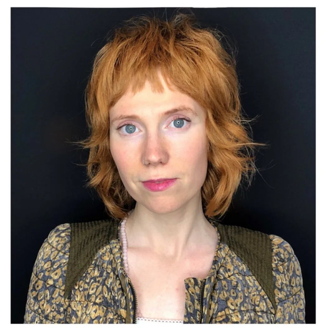 Ginger shag mullet with micro fringe and flipped nape layers