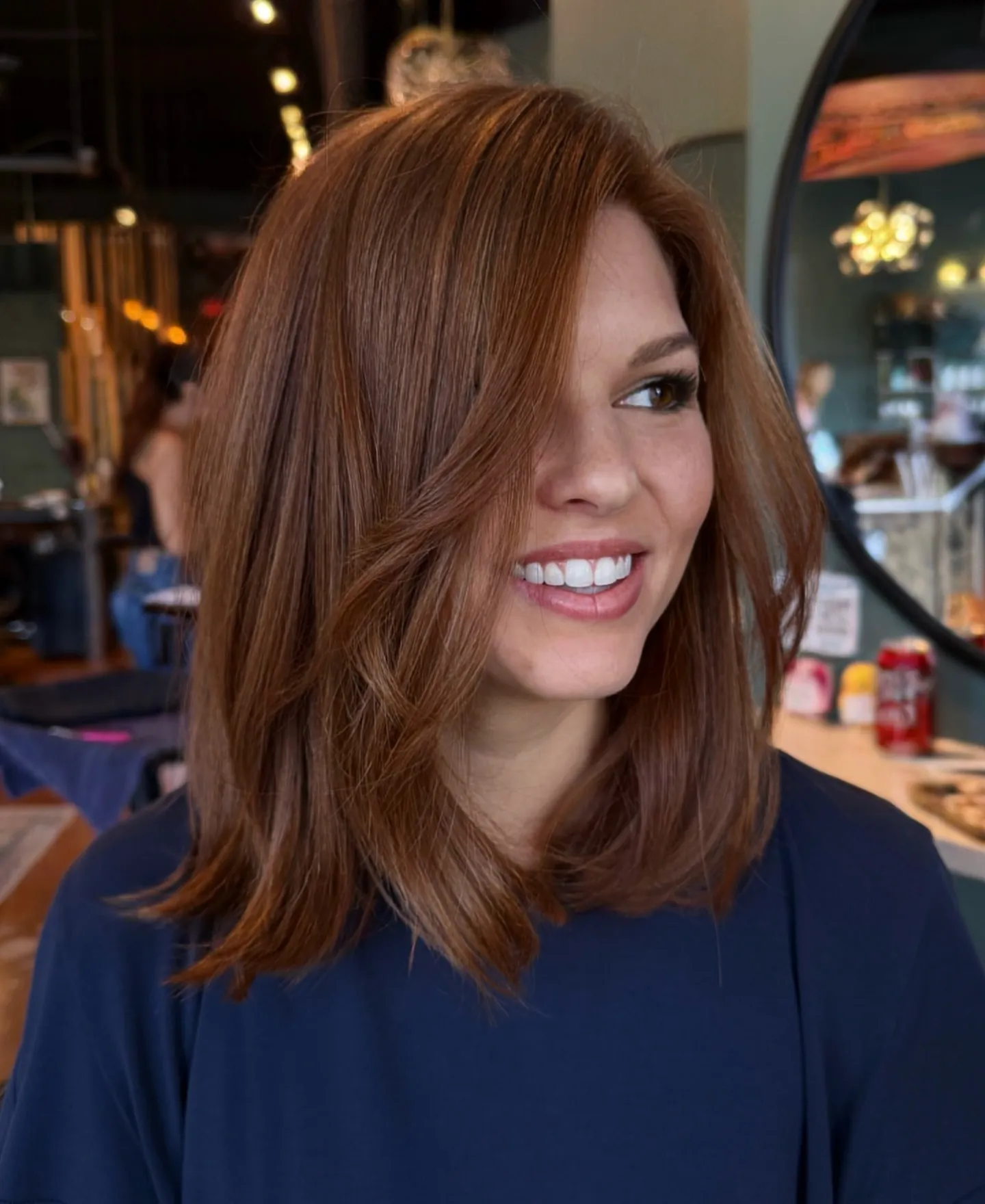 Long auburn side-part lob with soft layers