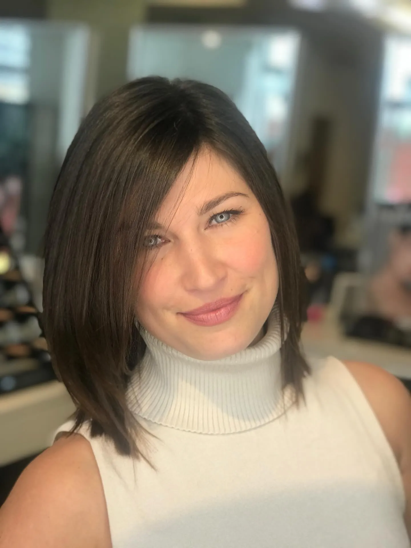 Sleek angled dark lob with deep side fringe