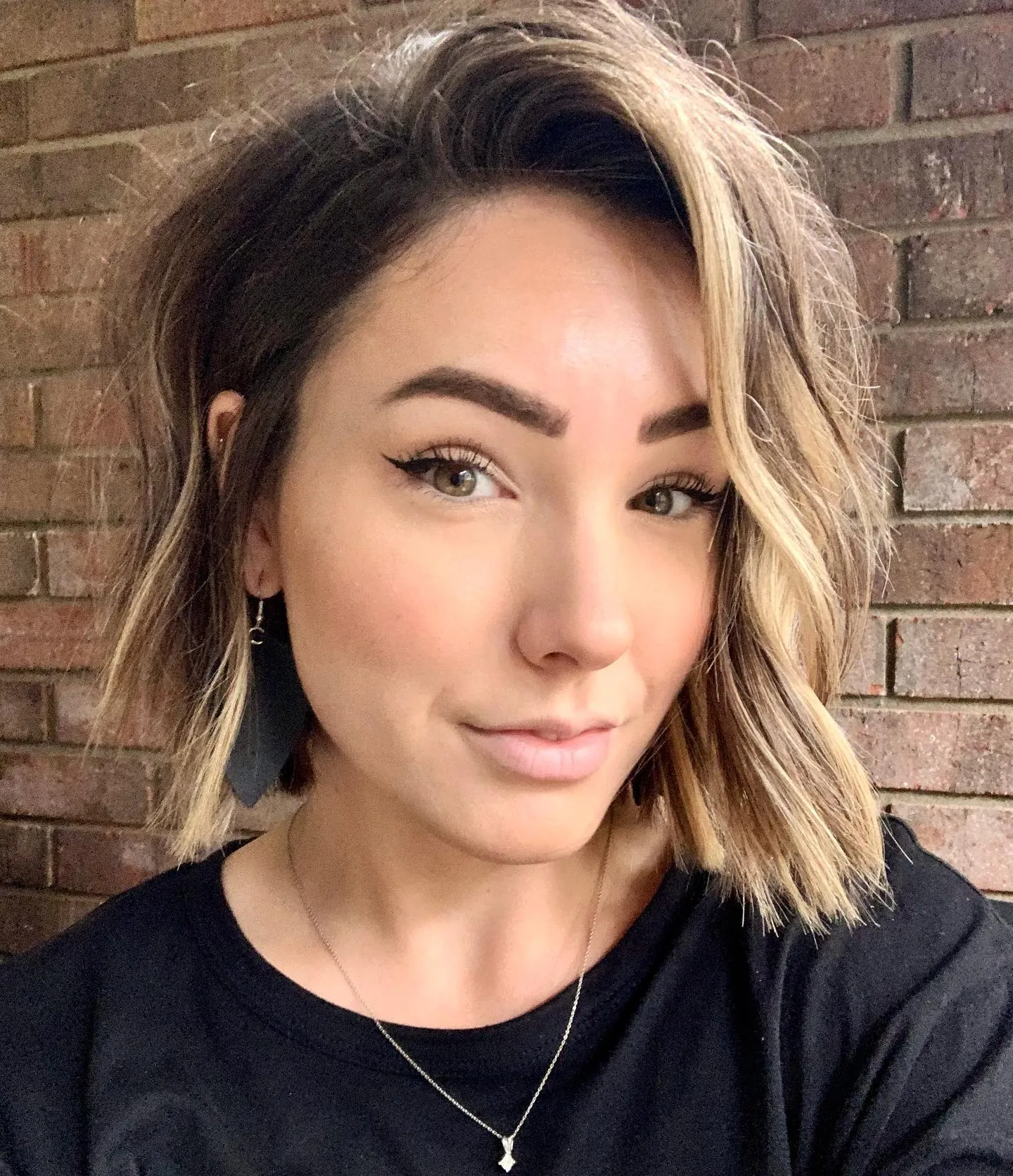 Deep side-part lob with blonde face-framing pieces