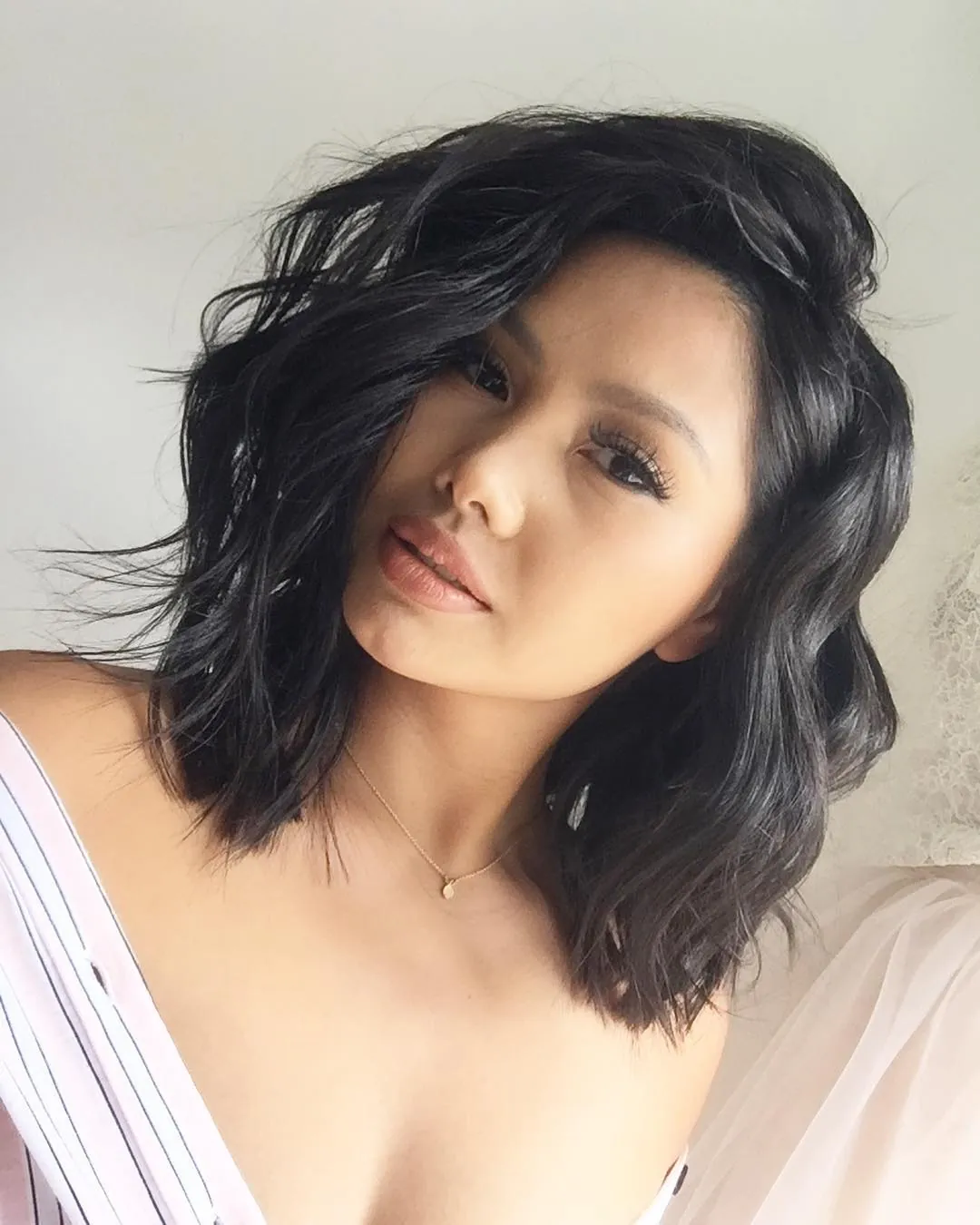 Choppy black wavy lob with tousled texture
