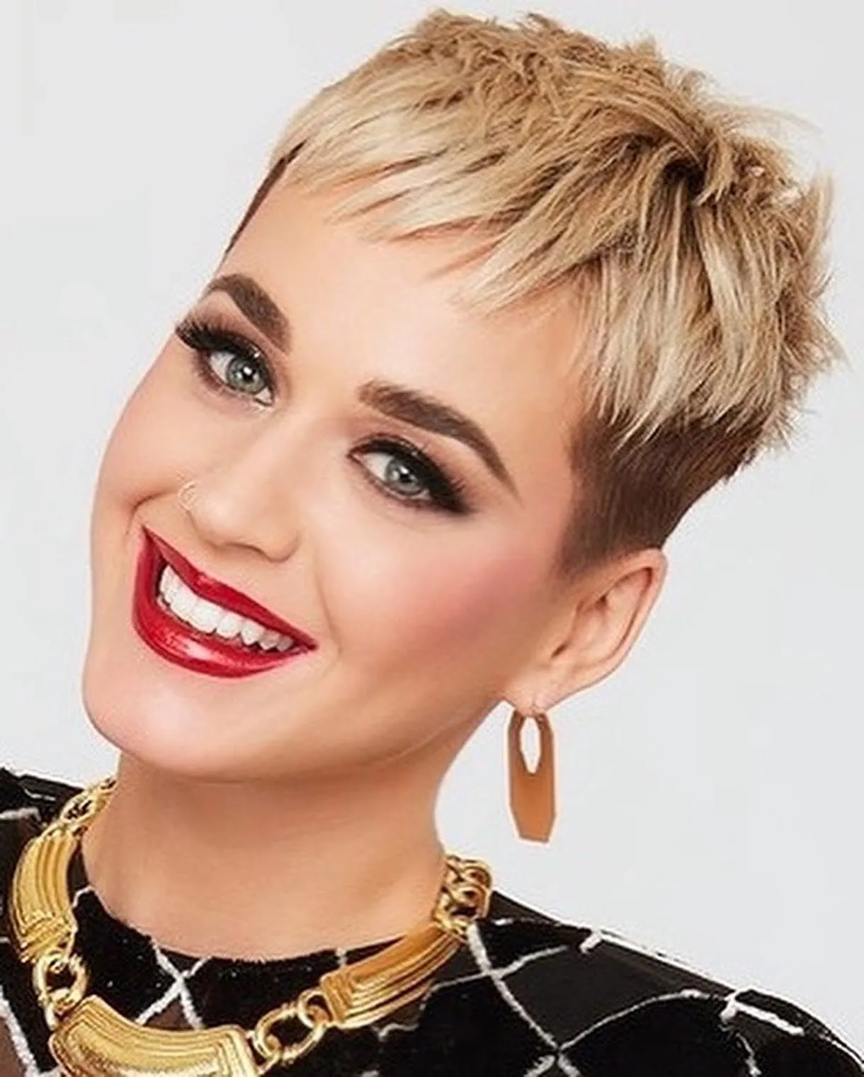 Short blonde pixie with smooth sides and textured top