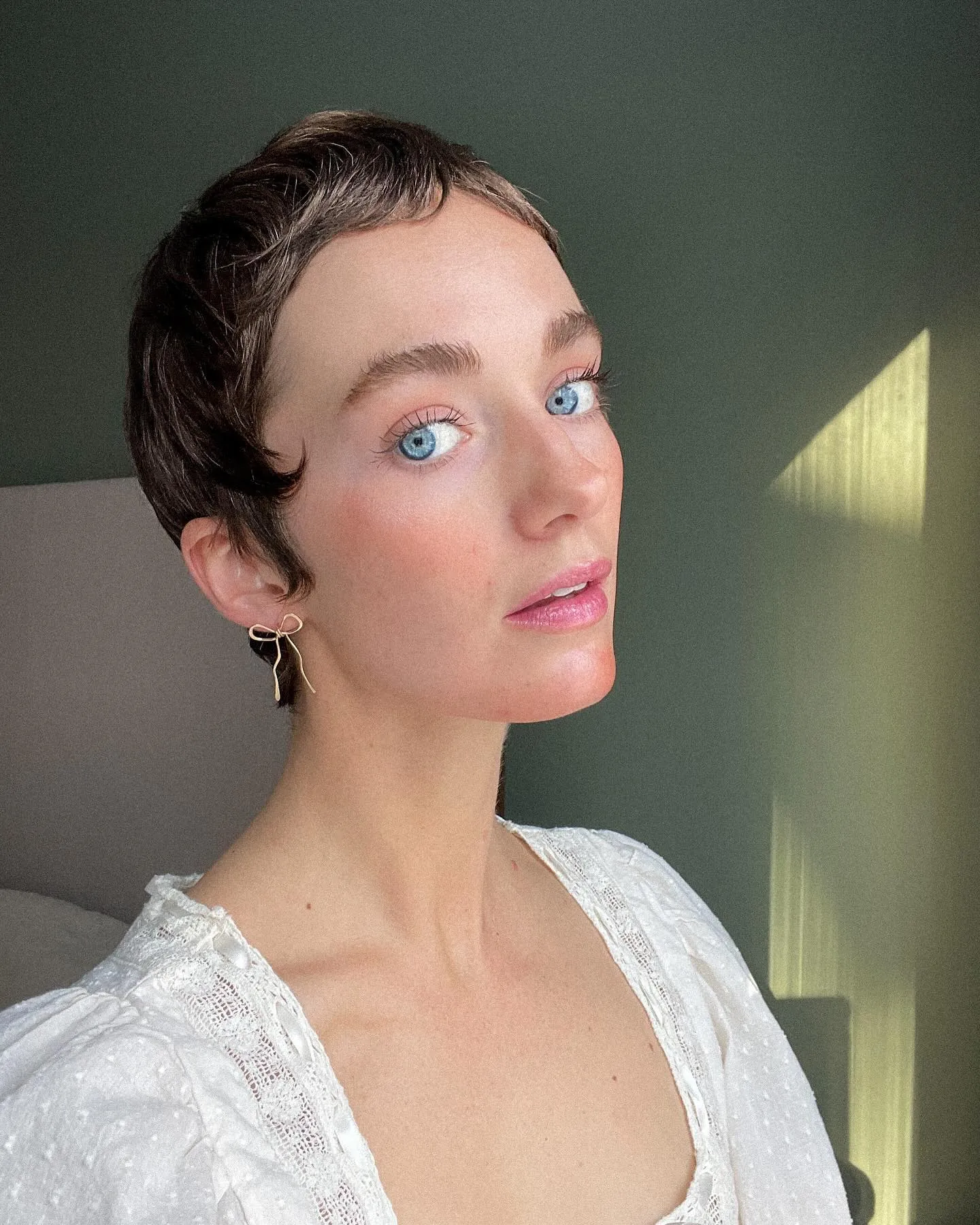Dark slicked pixie with sculpted finger-wave detail