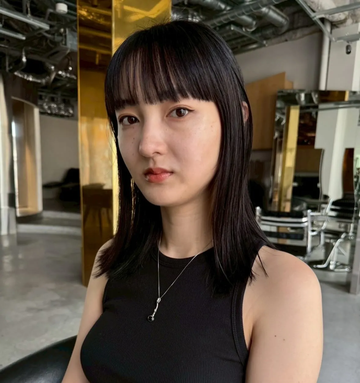 Straight Bangs With Layers showing soft black hair colour